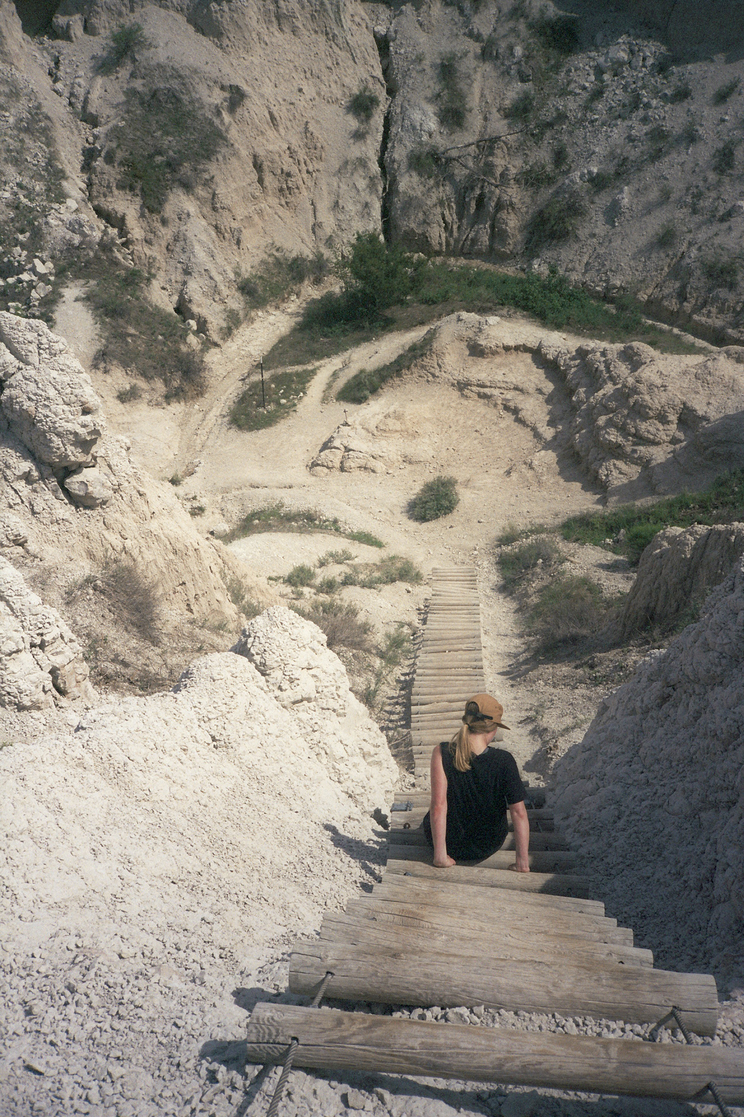 Lisa Beggs Climbs Ladder on Trail in Badlands