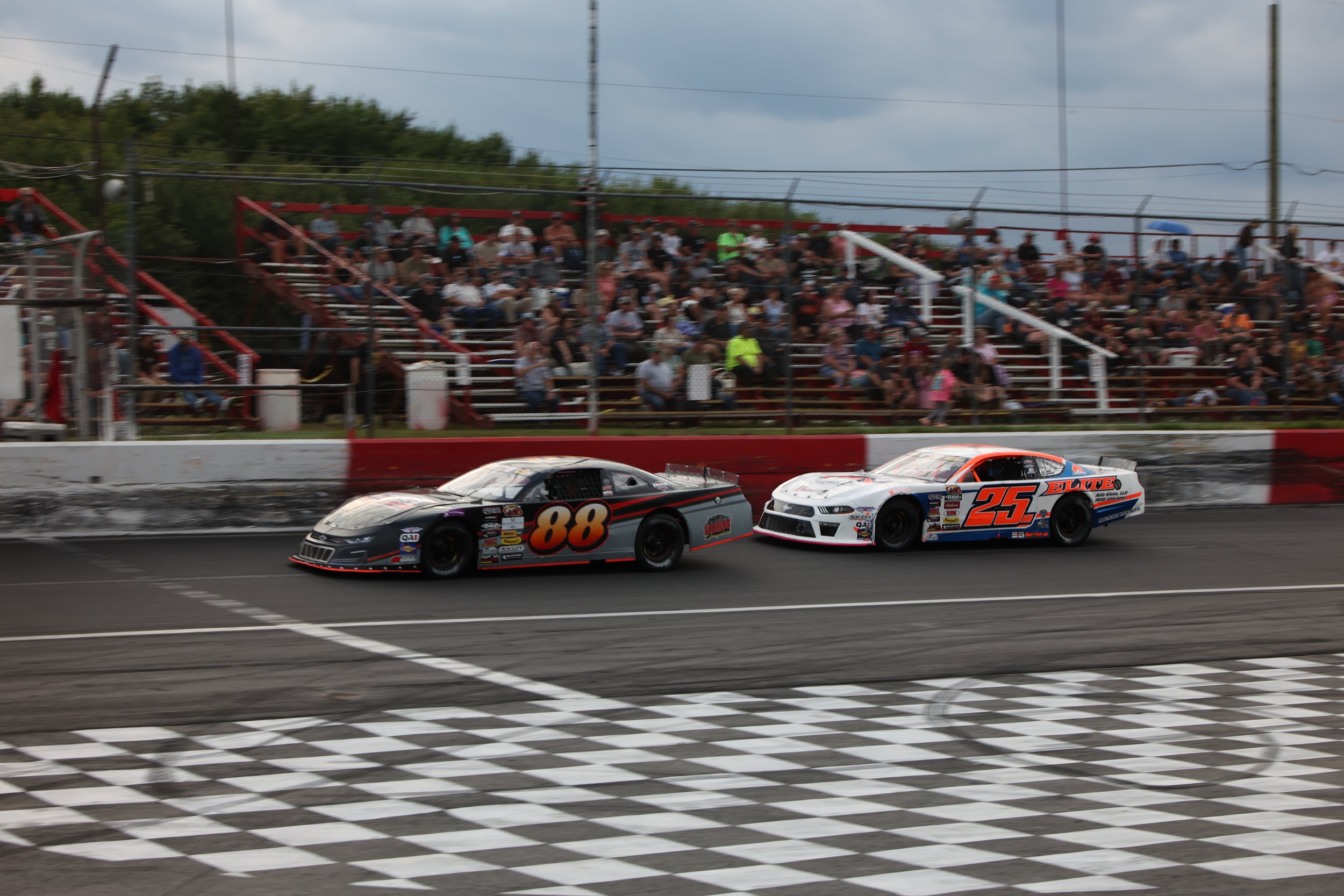 Jesse Switser Bests Nick Sweet with Three-to-Go for the Great North Woods 150 at Riverside
