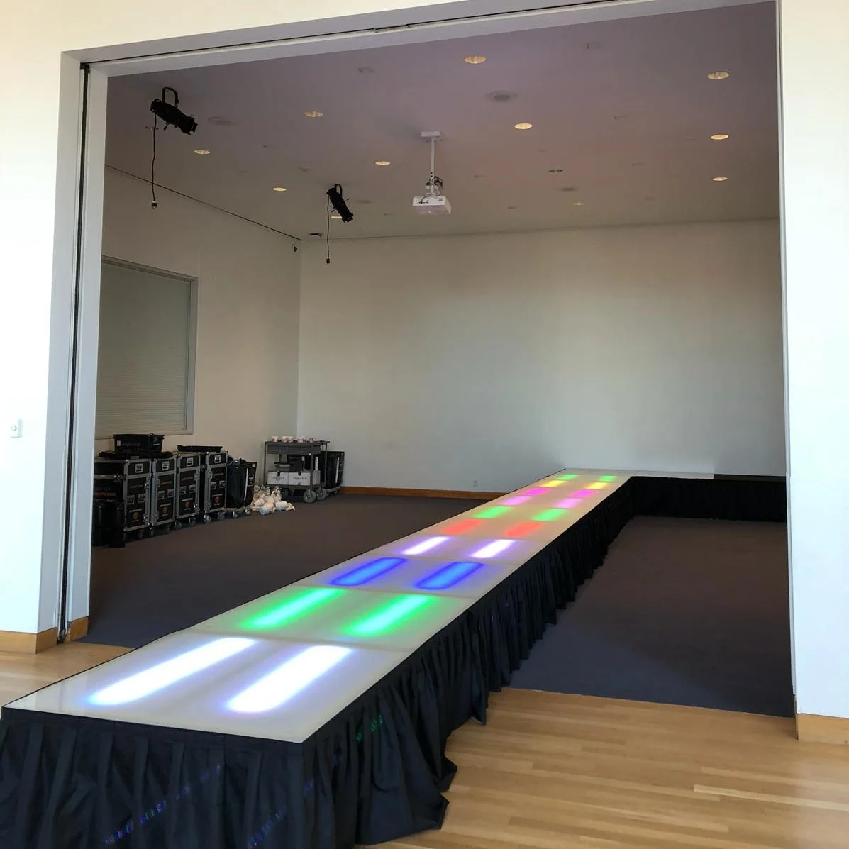 Frosted Stage with Uplighting for Runway at Weisman Art Museum