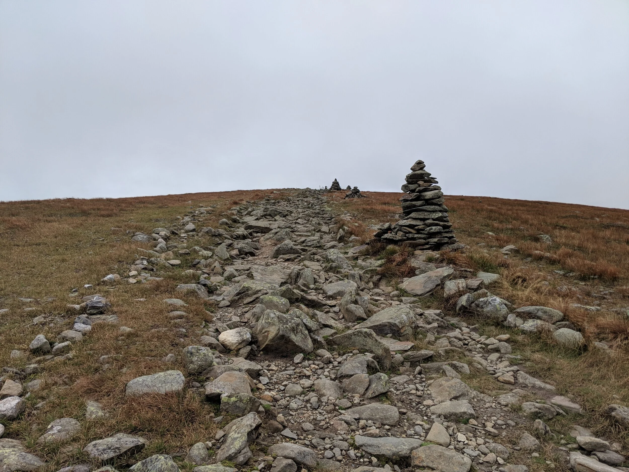 Approaching the summit, valley obscured by clouds
