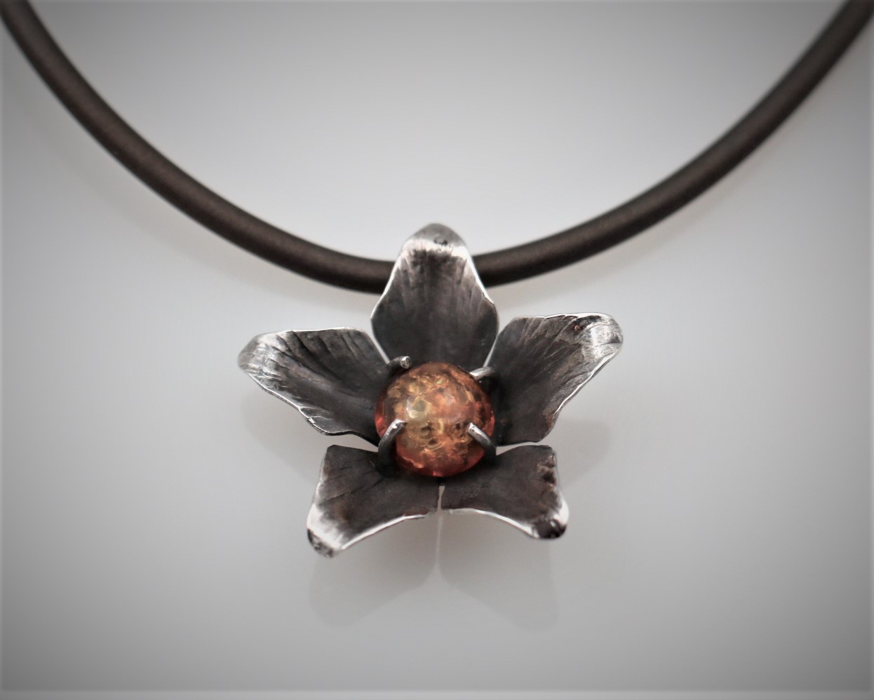 Oxidized sterling silver with Baltic amber and black rubber cord