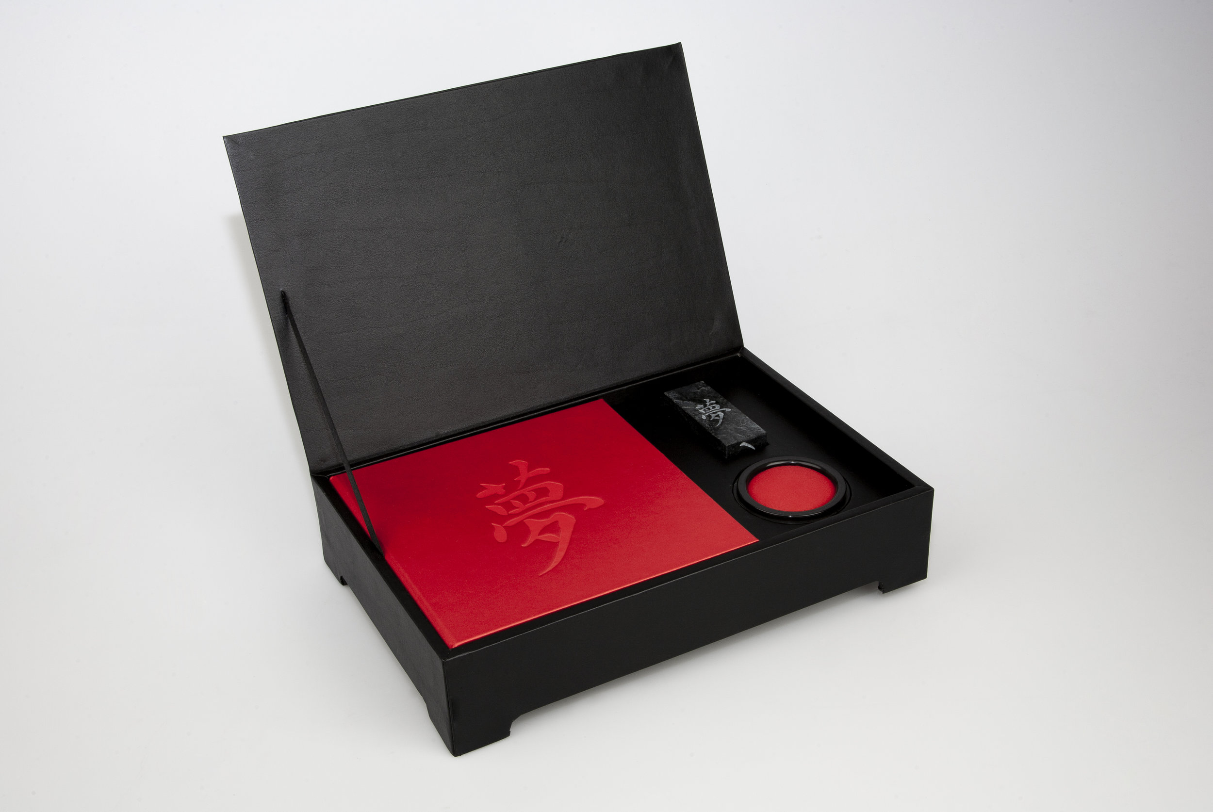 ICLA designed a leather stationery box to hold a presentation book, a personalized hanko (chop), ink well, a set of cards and envelopes and an instruction sheet on how to use and maintain the hanko.
