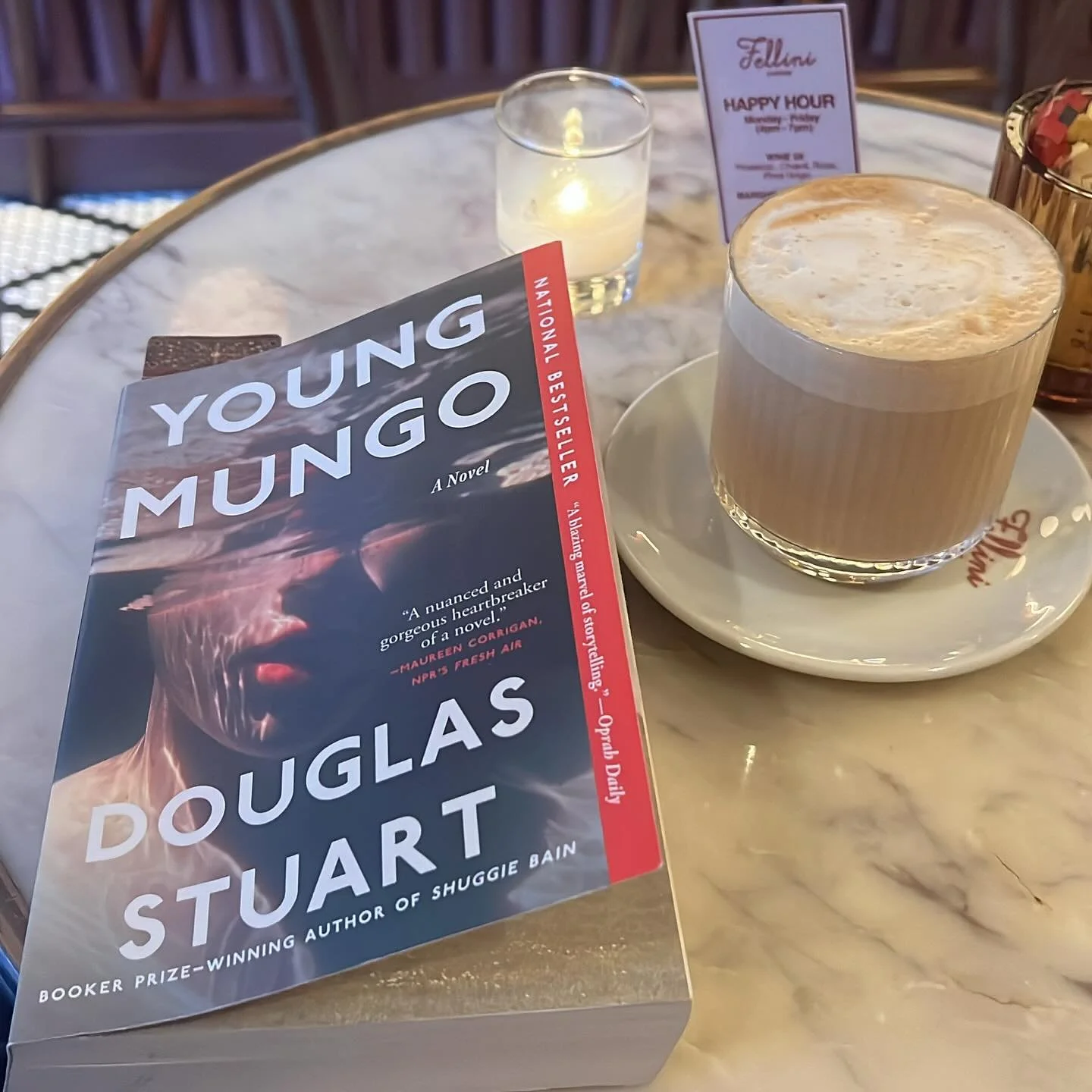 Reading queer love stories in public spaces feels quietly revolutionary. Douglas Stuart&rsquo;s Young Mungo is breaking my heart and healing it at the same time.
.
.
.
#Bookstagram #CoffeeAndBooks #CurrentlyReading #YoungMungo #DouglasStuart #QueerRe
