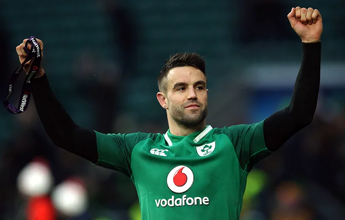 Conor Murray celebrates Ireland's historic Grand Slam at Twickenham.