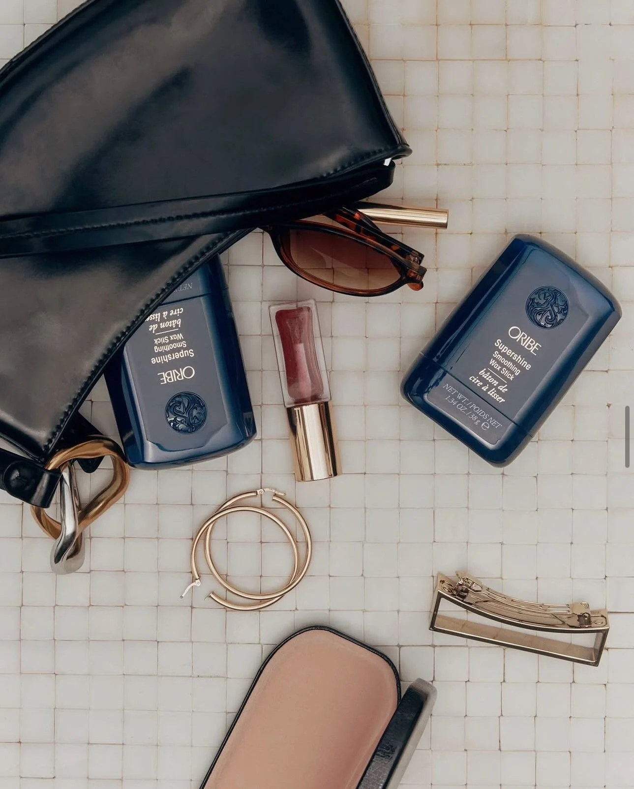 Compact enough to fit in your pocket. Massive in impact.

Swipe on the Supershine Smoothing Wax Stick for instant smoothness, soft radiance, and total control over even the most stubborn flyaways. #oribeobsessed ✨