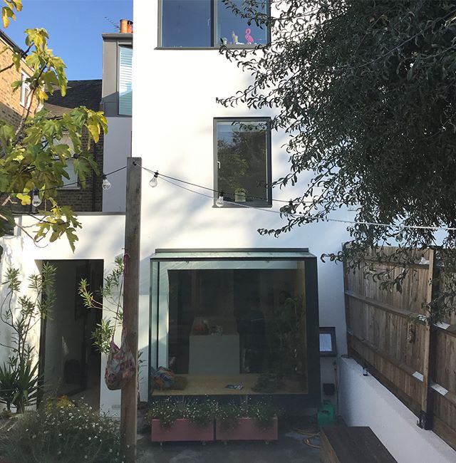 Extension, loft, structural glass window seat and pivot door still looking good a year on. #se4 #construction #zinc #structuralglass #structuralglazing #windowseat