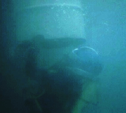 Inside the 55-gallon drum is a pipe puzzle the diver must put together with a large crescent wrench. The puzzle must be completed before the diver's exhaust bubbles fill the drum enough to rise it to the surface.