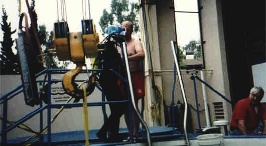 After the exercises are completed, Wes leads Dom back to the surface station where she can get out of her gear and pass it on to the next diver.