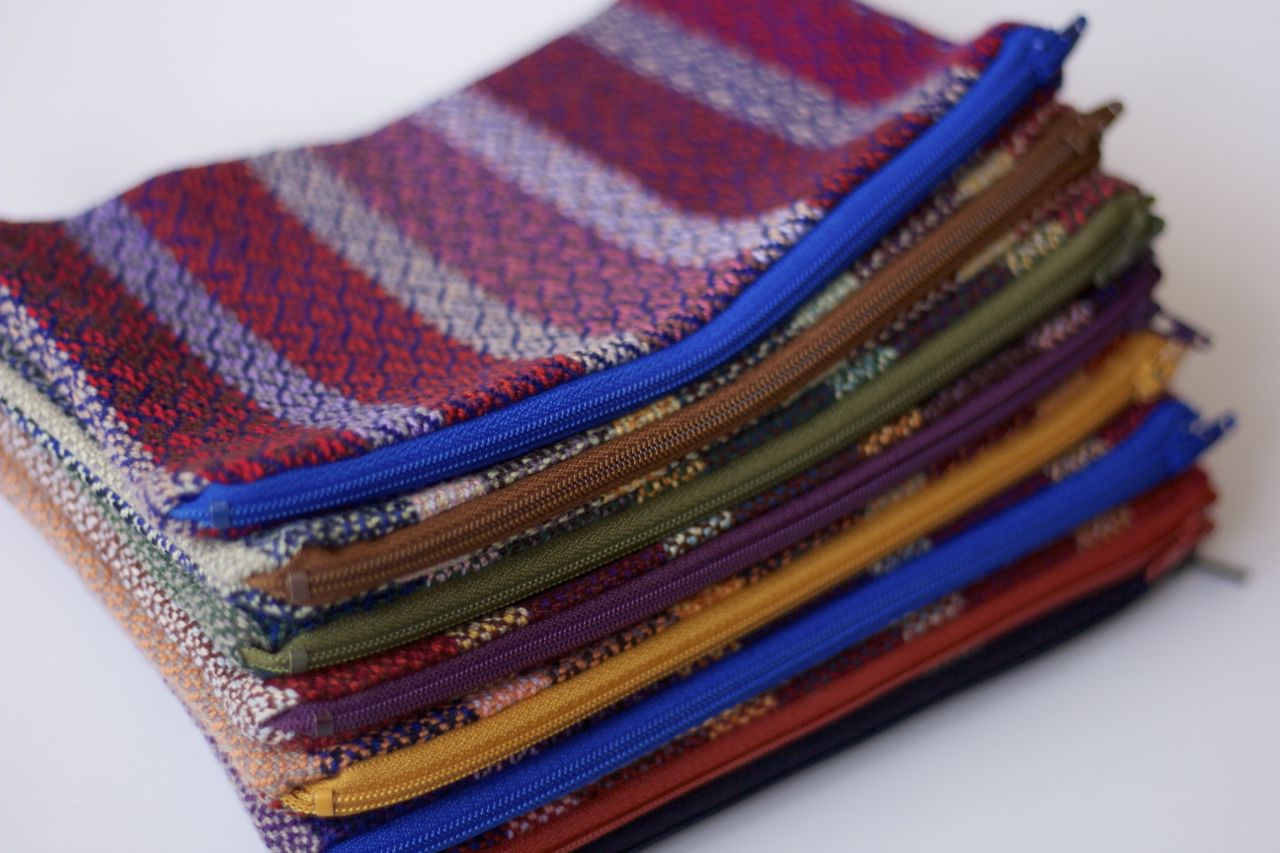 pouches: handwoven cotton exterior with zipper and lining.