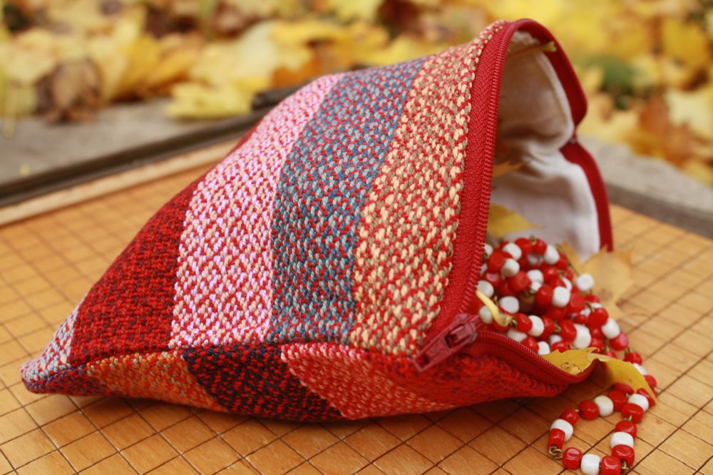 pouch: handwoven cotton exterior with zipper and lining.