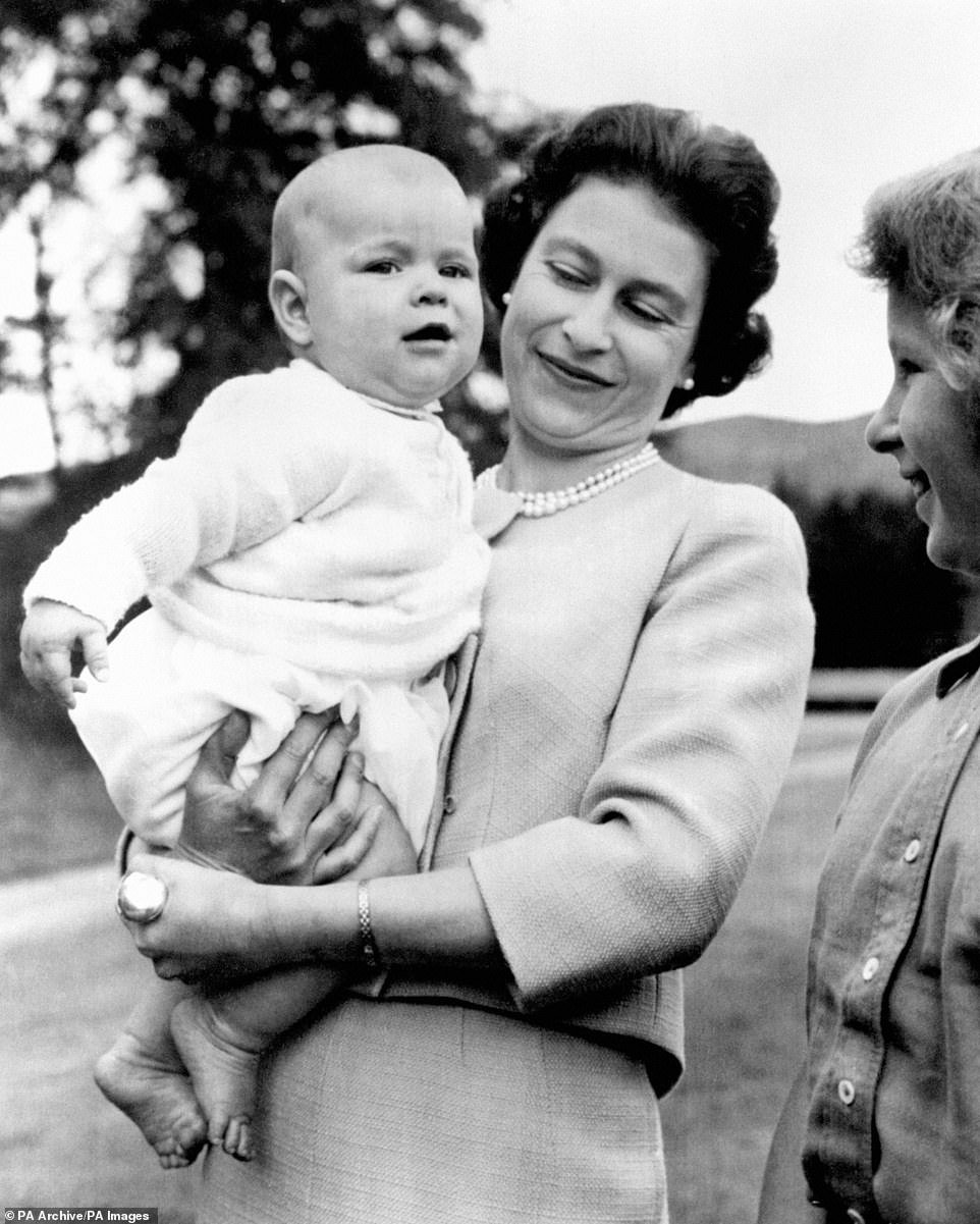 21584006-4422534-1960_Royal_baby_Queen_Elizabeth_II_holding_Prince_Andrew_during_-a-73_1648451885565.jpg