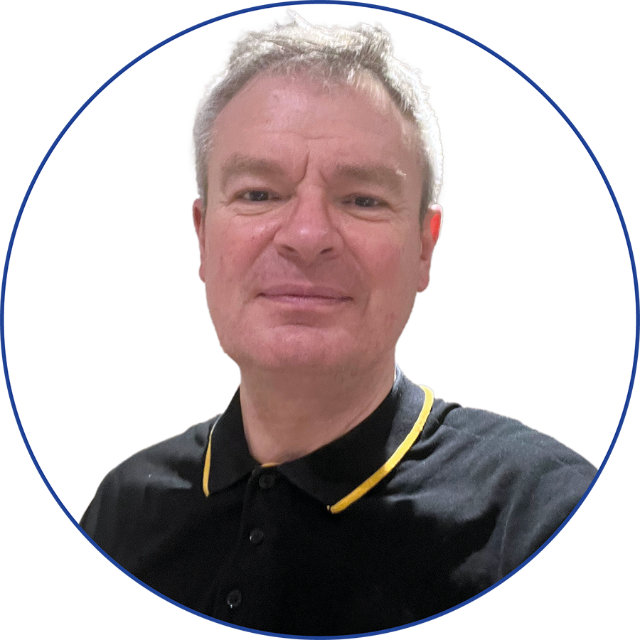A middle-aged man with short gray hair wearing a black polo shirt with yellow collar trim, smiling slightly, against a white background with a blue border.