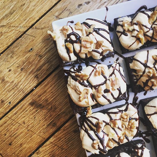 Fresh chocolate brownies with a peanut butter cream cheese frosting