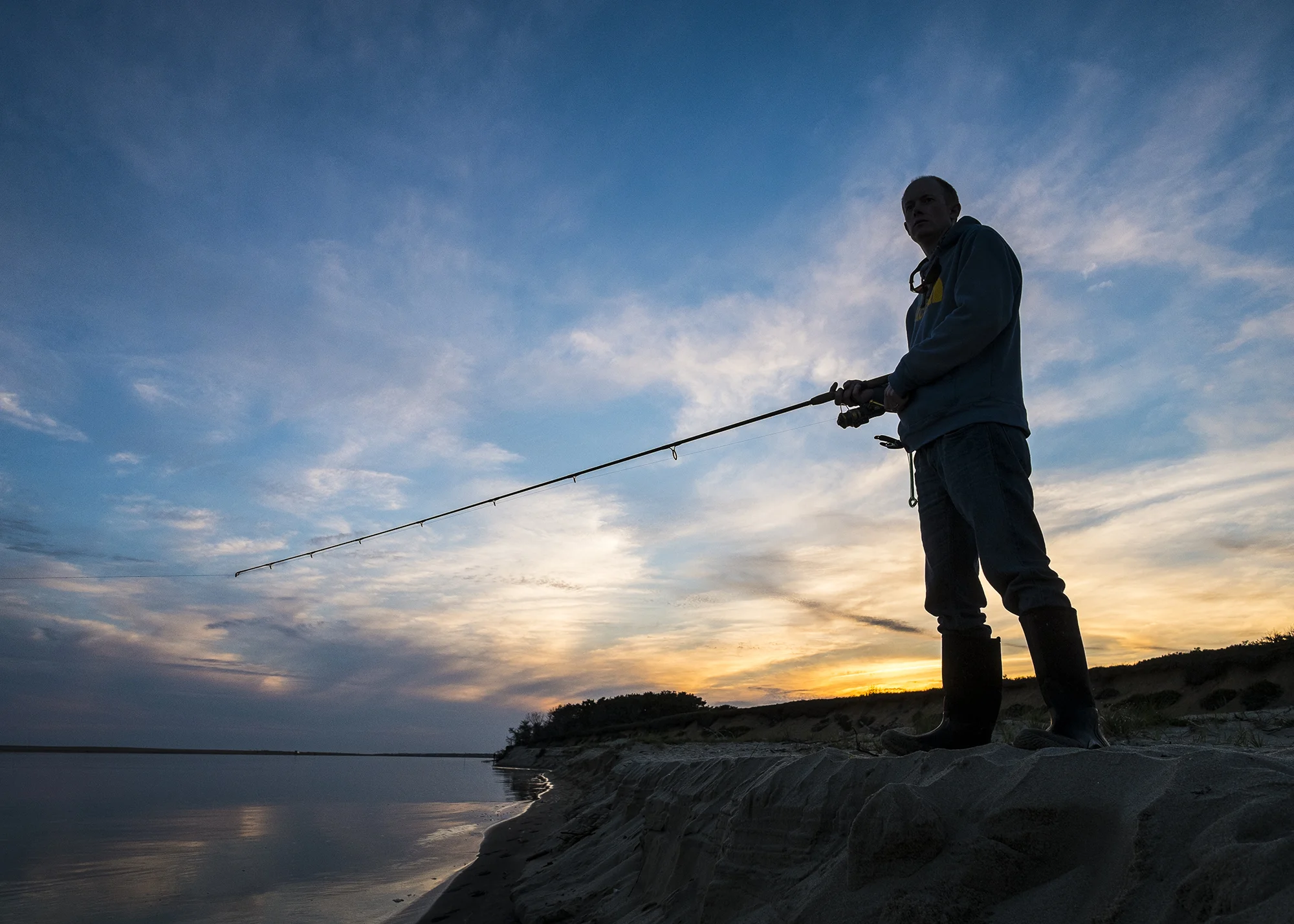 Luke Etherington fishing off of Wasque - Chappaquiddick Island, Martha's Vineyard, Massachusetts.