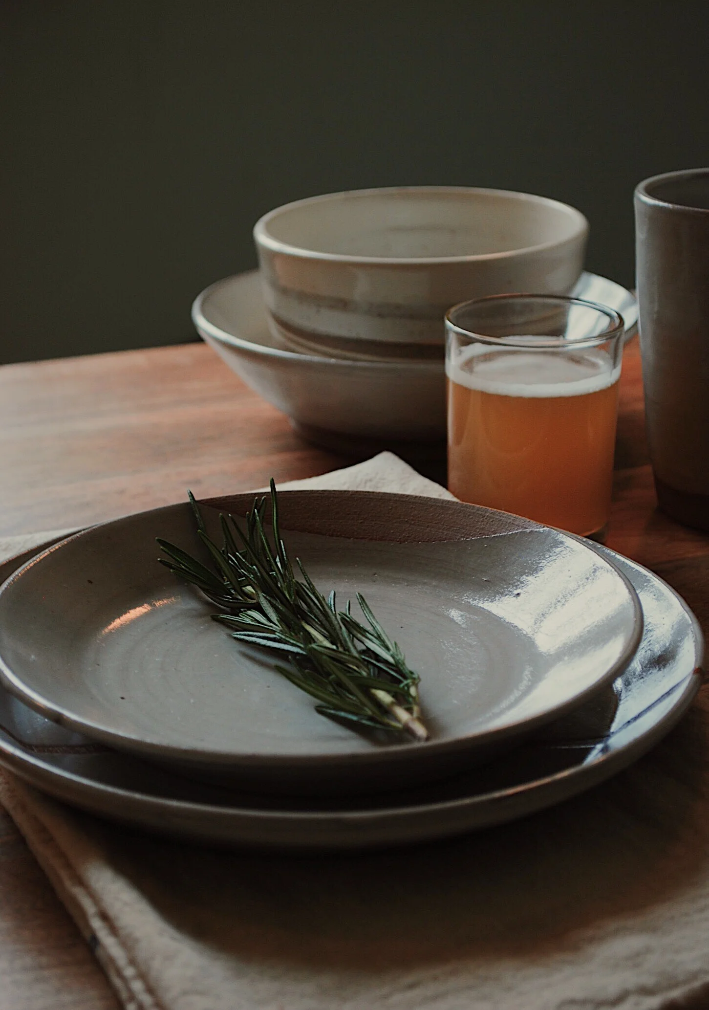 Photo by Ellen Buley - A custom set of plates and misc. dishes from Doghouse Pottery