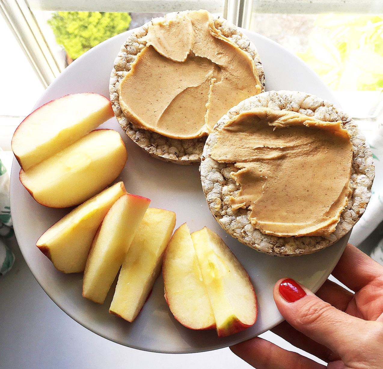 Wholegrain rice cakes, some peanut butter and a small apple (which I always cut up because it is nicer!). Other little snacks I have are a couple of squares of dark mint choc (omg, it’s so yummy), or a couple of crackers with some soft cheese on, but the peanut butter is by far my fave!! Lucy - From Lucy With Love