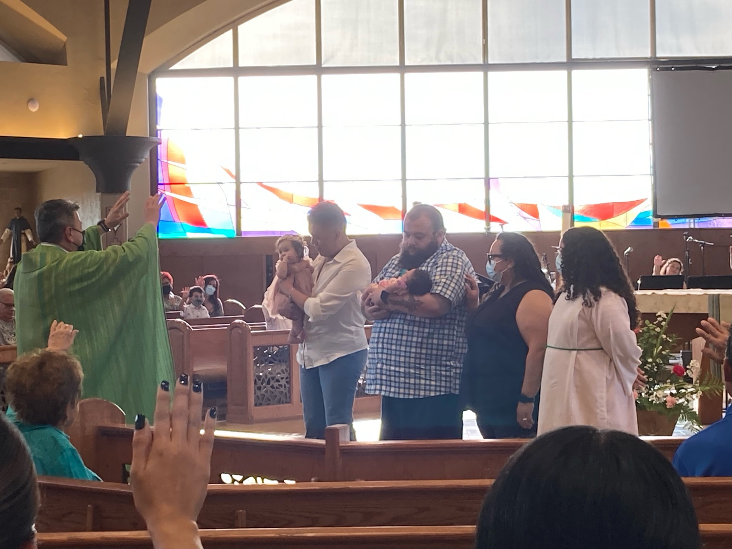 Fr. Ben welcoming 2 little ones to the Community and Blessed them.