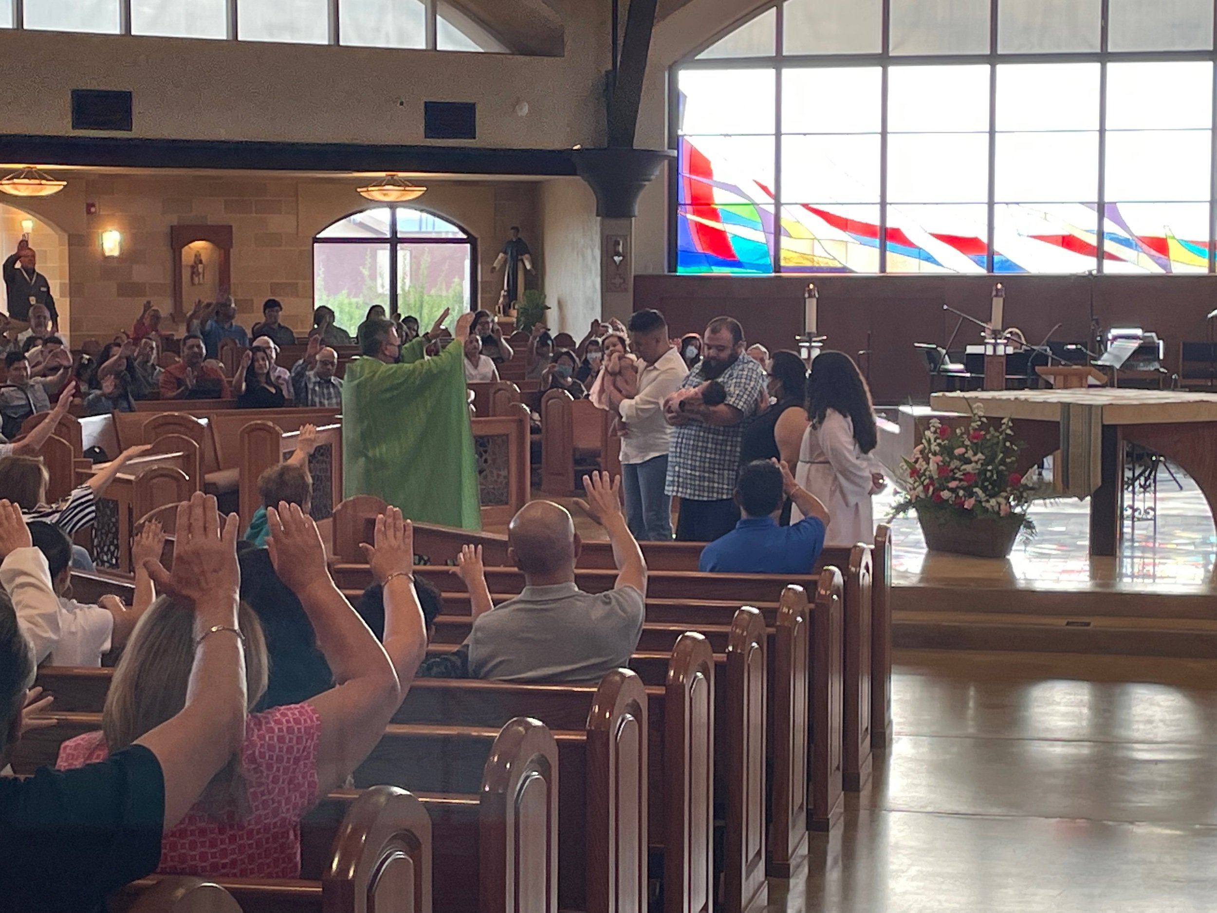 Fr. Ben welcoming 2 little ones to the Community and Blessed them.