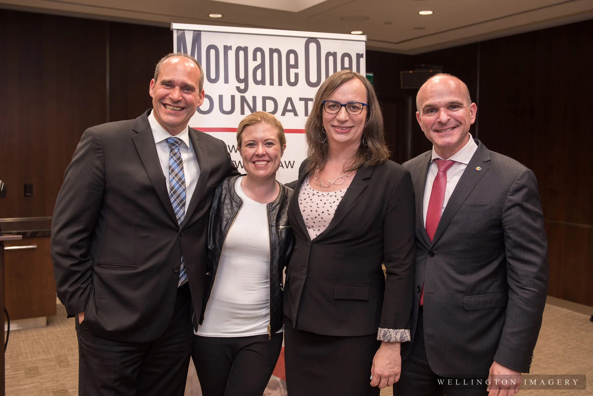 (From the left) NDP House Leader Guy Caron, the Hon. Michelle Rempel, Trans rights activist Morgane Oger, and LGBTQ2 Special Advisor to the Prime Minister Randy Boissonnault pose for a family photo at the May 29 reception for inclusion on Parliament Hill 