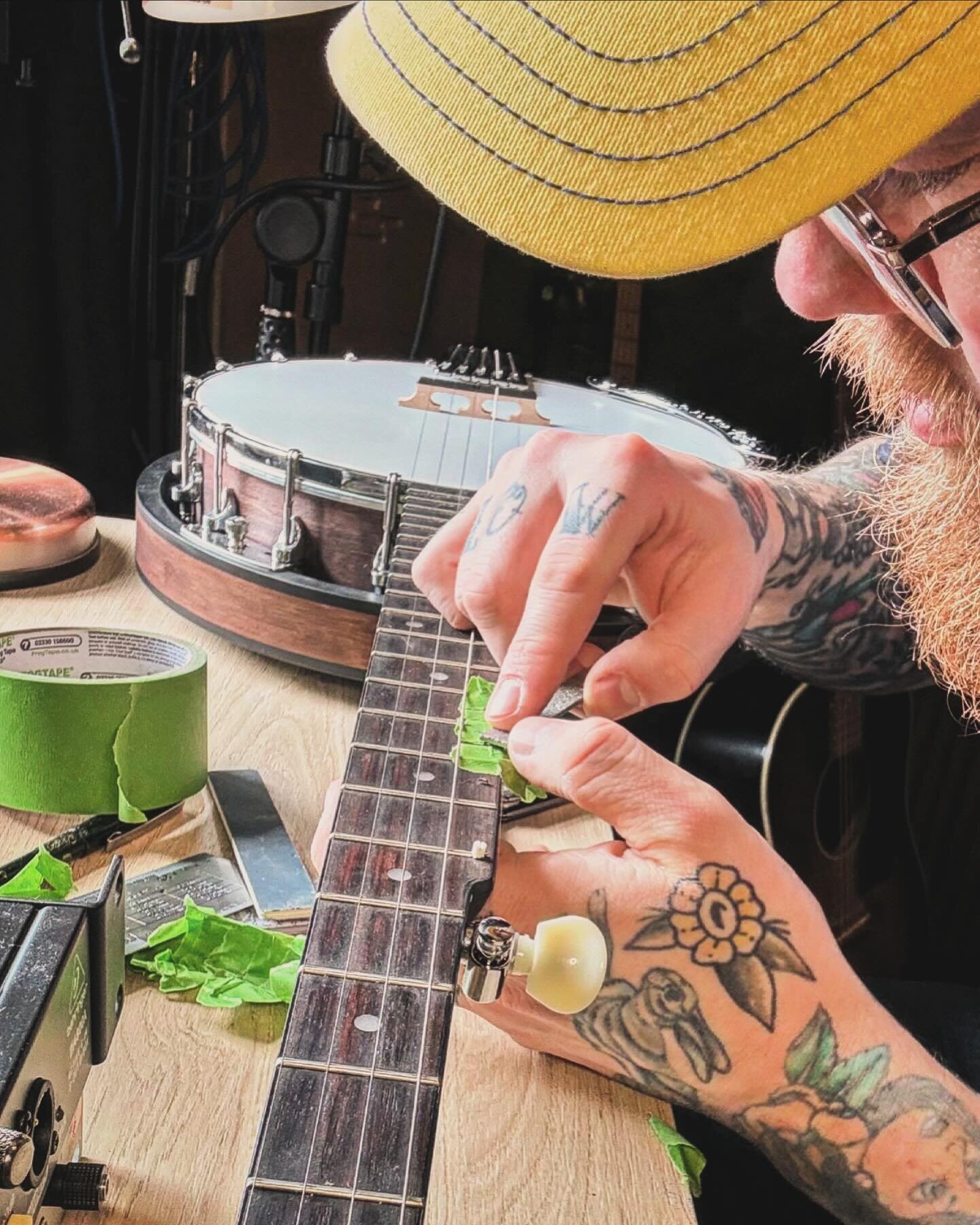 Though not a service I advertise as offering, I&rsquo;m always happy to help take a students banjo up a notch with a few railroad spikes! 

Here I am filing some down in place so we can play in all the keys!