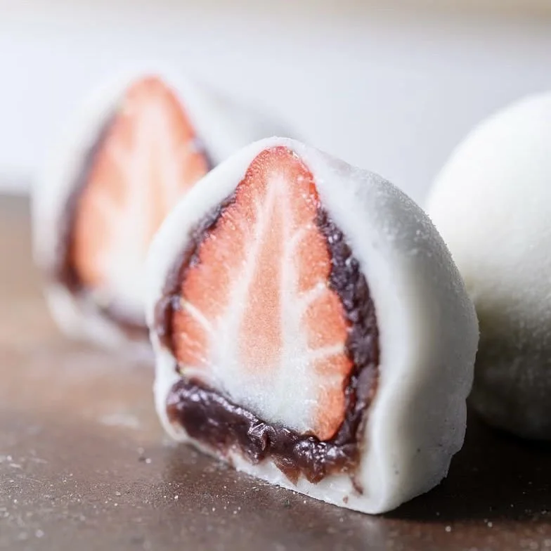 Soft mochi wrapped around sweet bean paste and a whole fresh strawberry