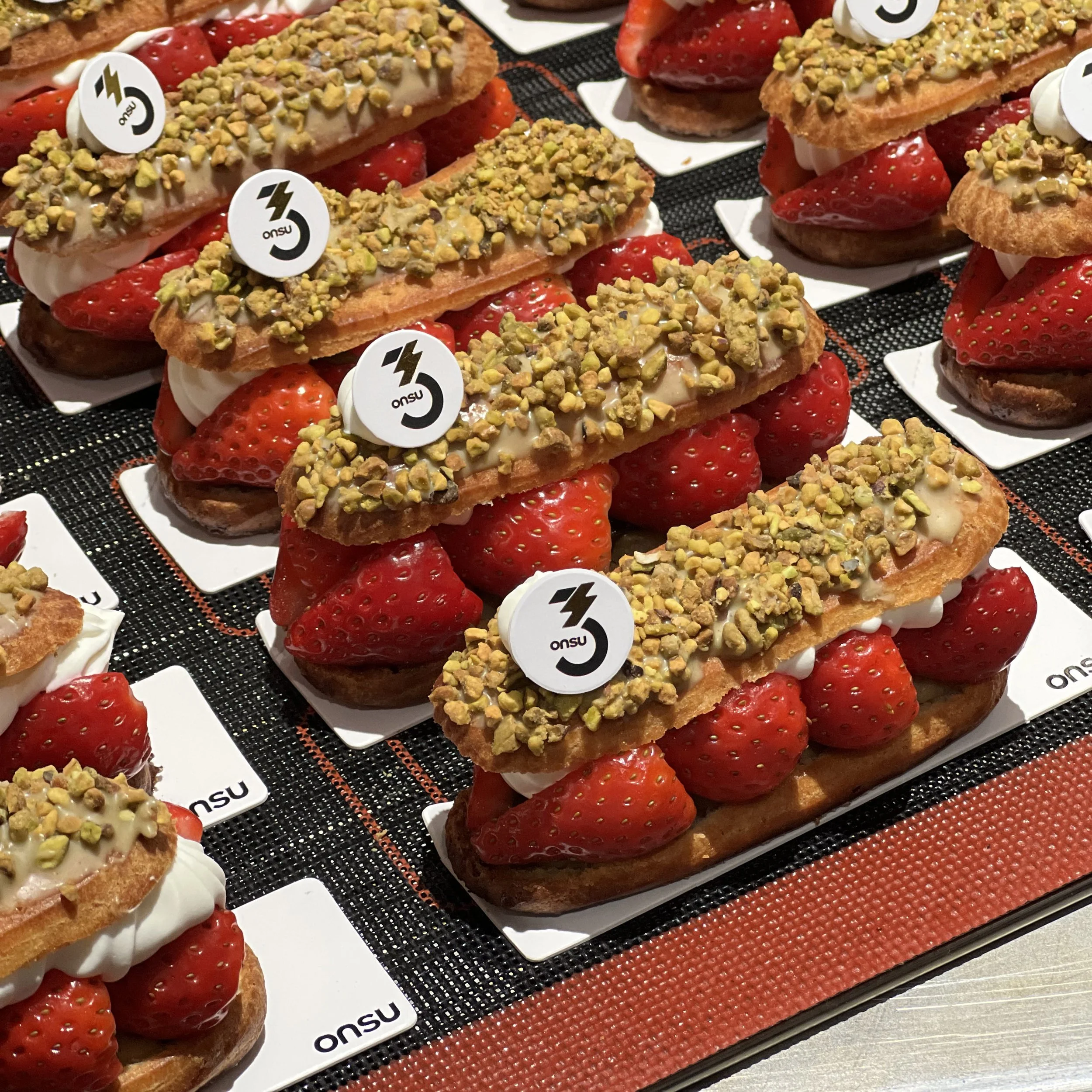 Pistachio and strawberry eclair