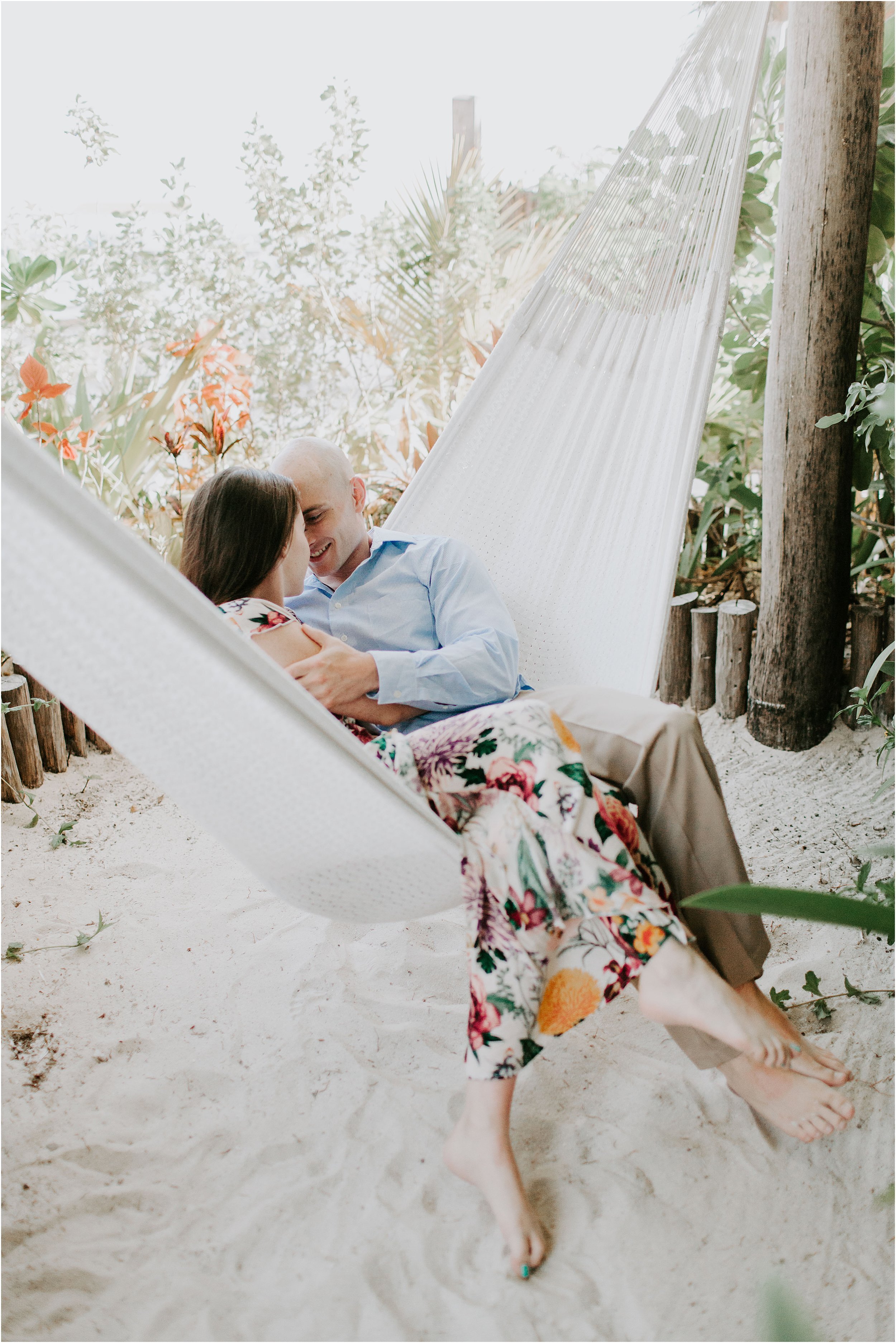  A couple snuggles in a hammock in Belize. 