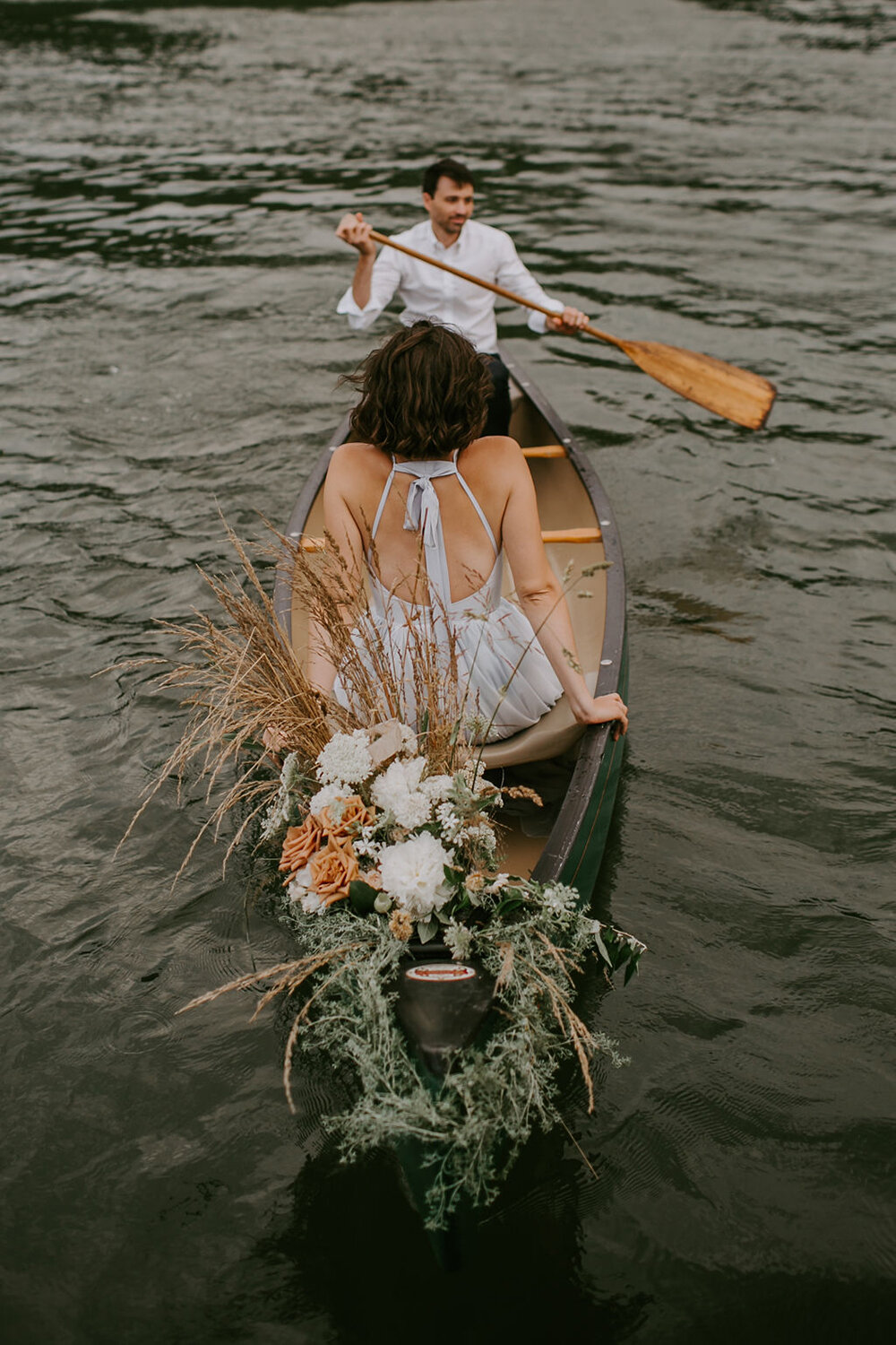 Bride and groom in a canoe. 