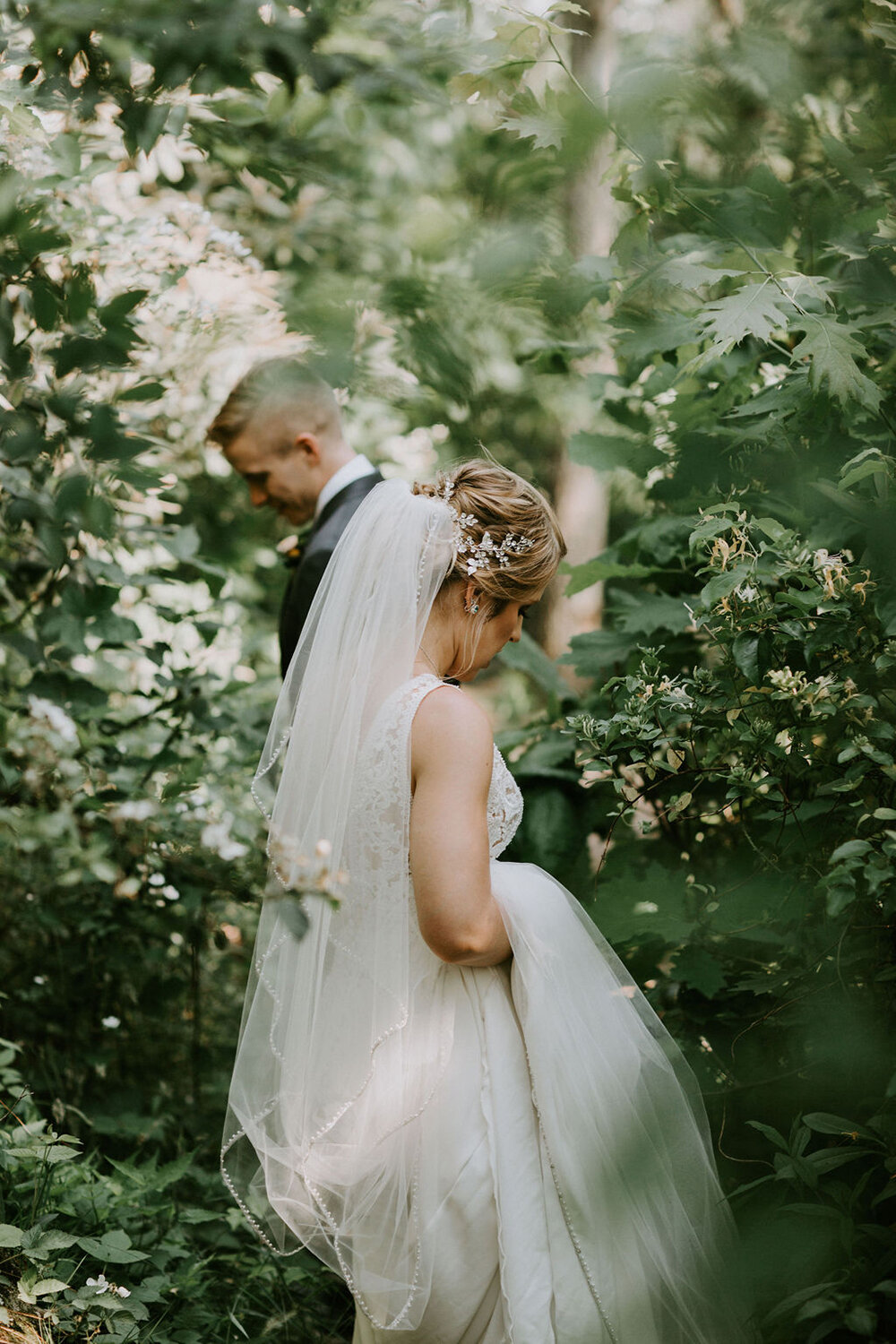 Bride and groom in the woods. 