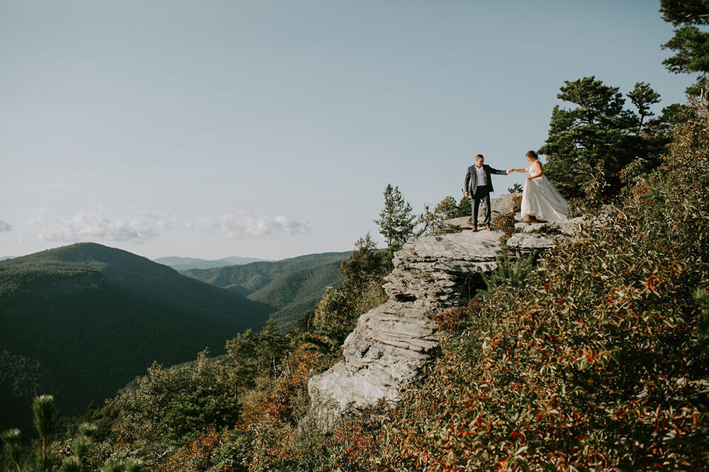 Bride and groom on a mountain for their elopement.