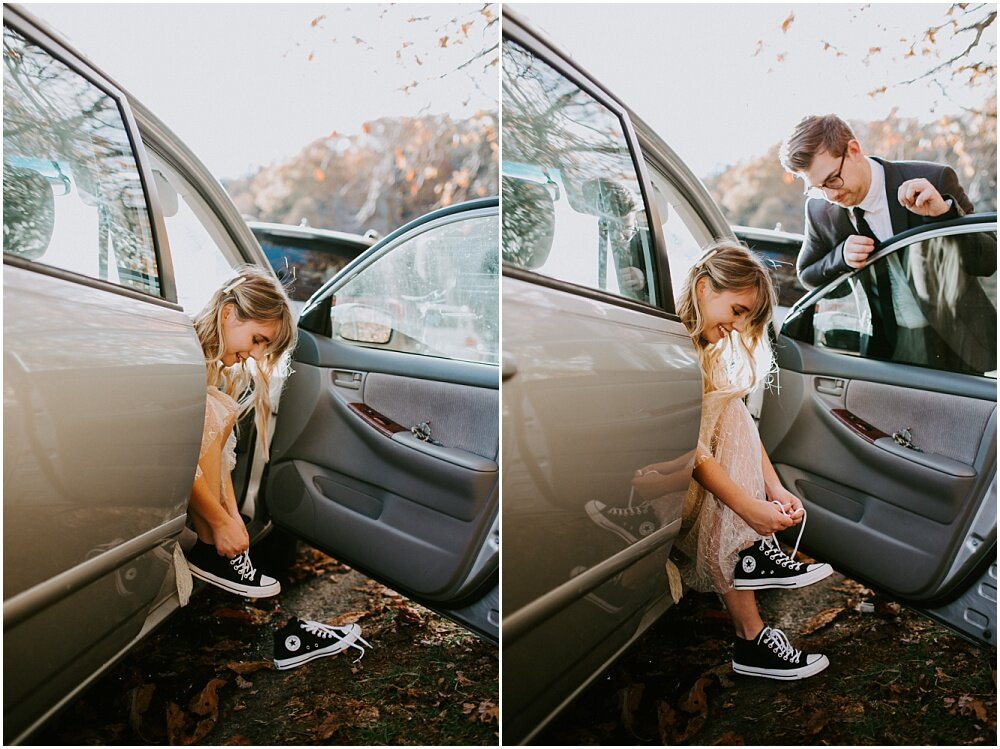 Bride puts on her shoes by the car. 