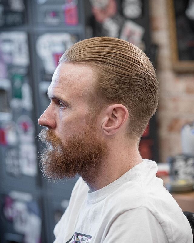 The vanguard style cut is a quiet cool. Not really flashy, it&rsquo;s understated, but still has an esthetic of a classic. It&rsquo;s combed straight back without the rise in the front of a pompadour. 
#azbarber #theholyblack #barbershopconnect #ariz