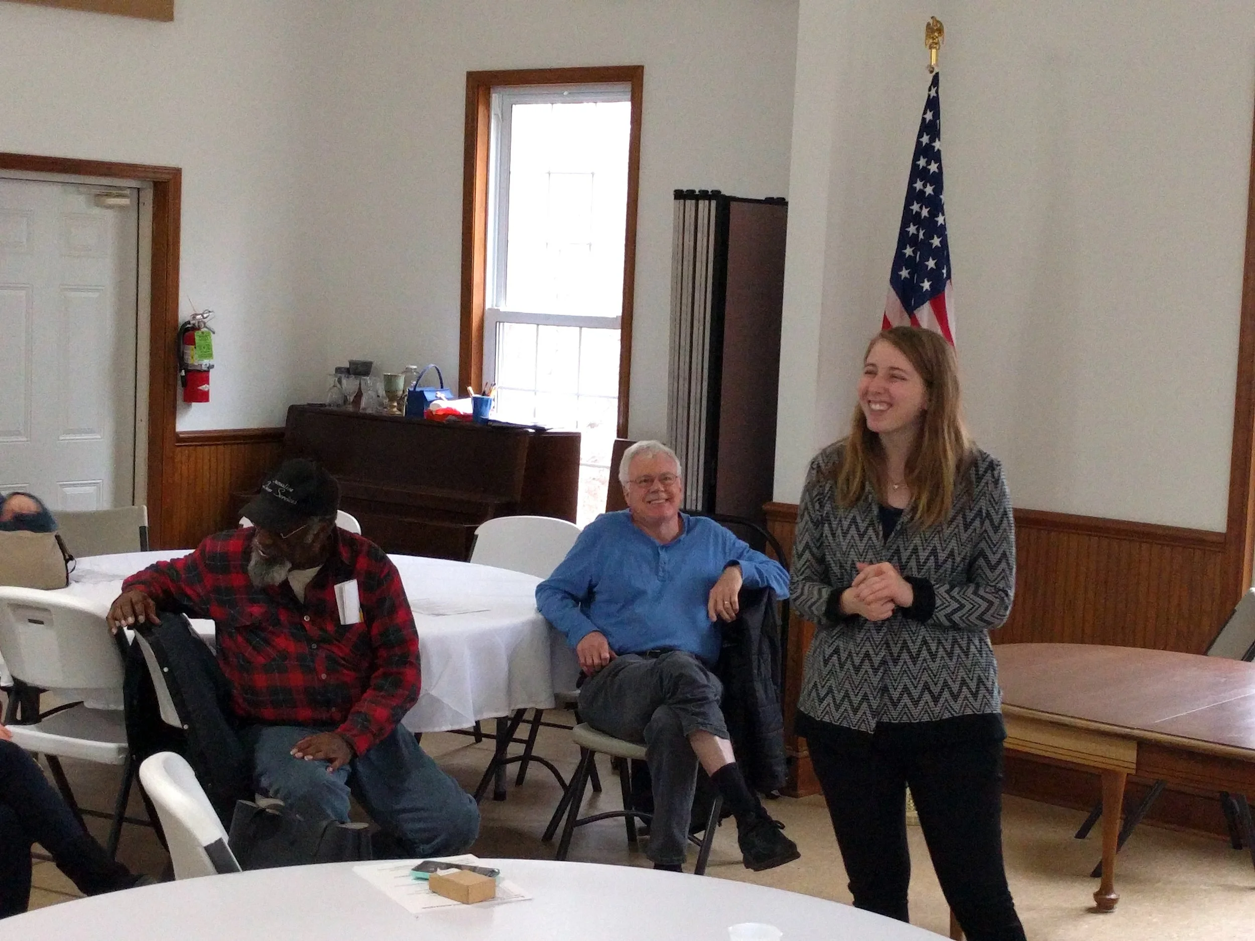 Caption: Kristen Powers speaks to group at a local event.