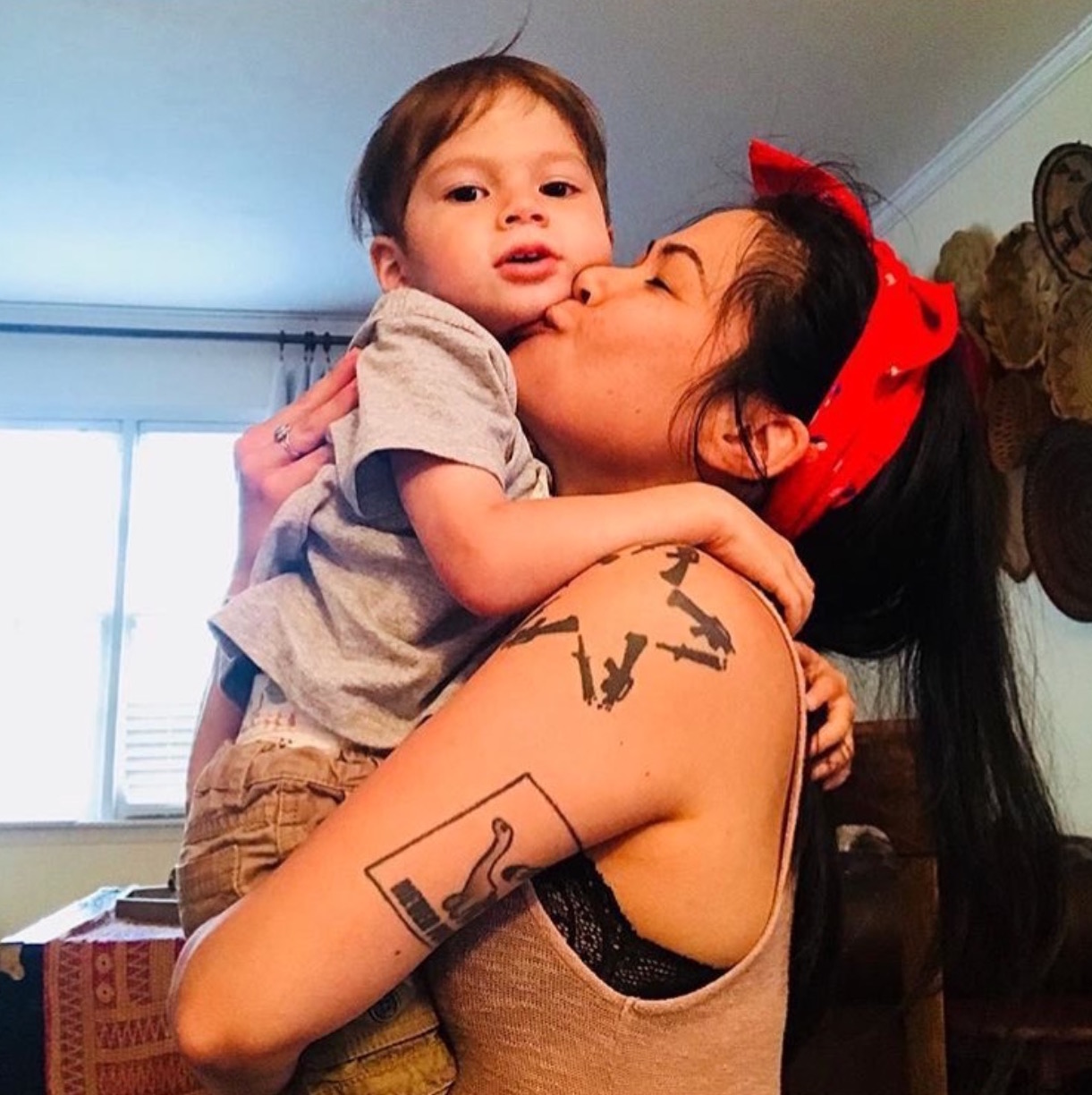 Katy loves looking cute while taking care of her boys.
