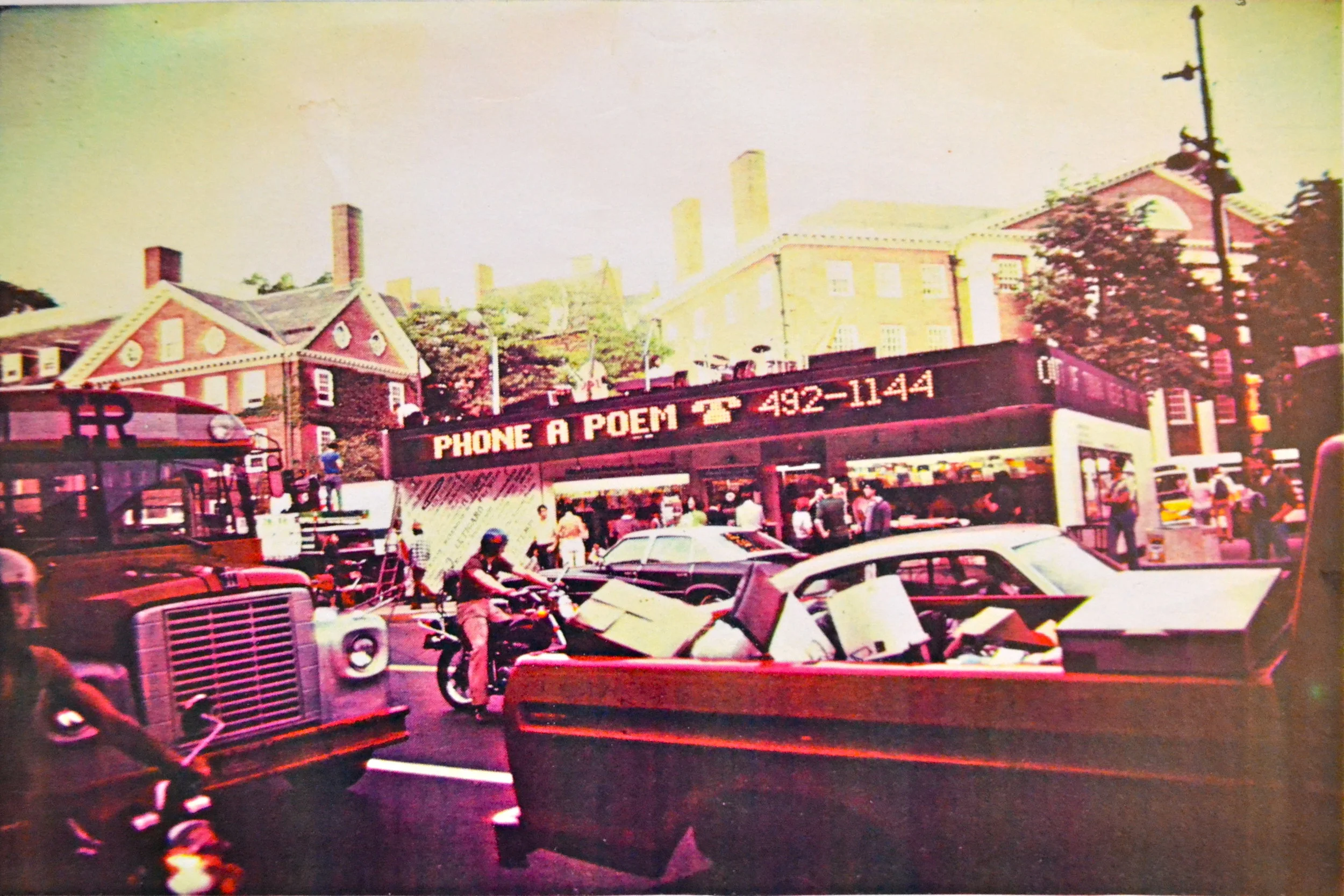 "Phone-A-Poem" on the iconic Out of Town News electric sign in Harvard Square in 1976. Peter Payack also arranged to have 24 different short poems displayed between new articles throughout the day.
