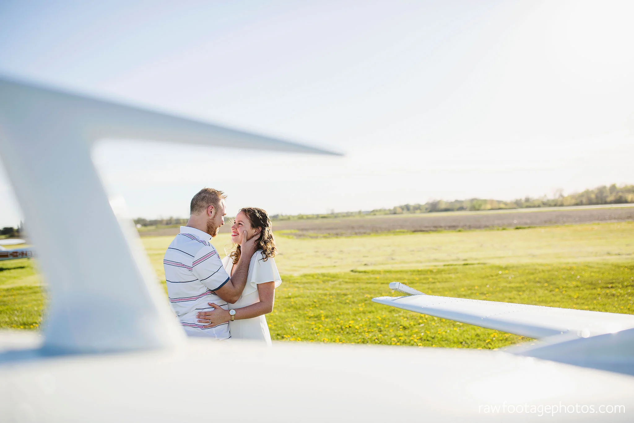 london_ontario_wedding_photographer-raw_footage_photography-engagement_session-airport_session-airplane-balloons-apple_orchard-spring_blooms-apple_blossoms005.jpg