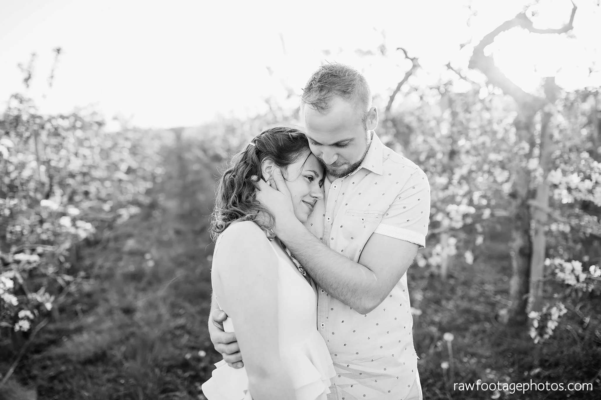 london_ontario_wedding_photographer-raw_footage_photography-engagement_session-airport_session-airplane-balloons-apple_orchard-spring_blooms-apple_blossoms028.jpg