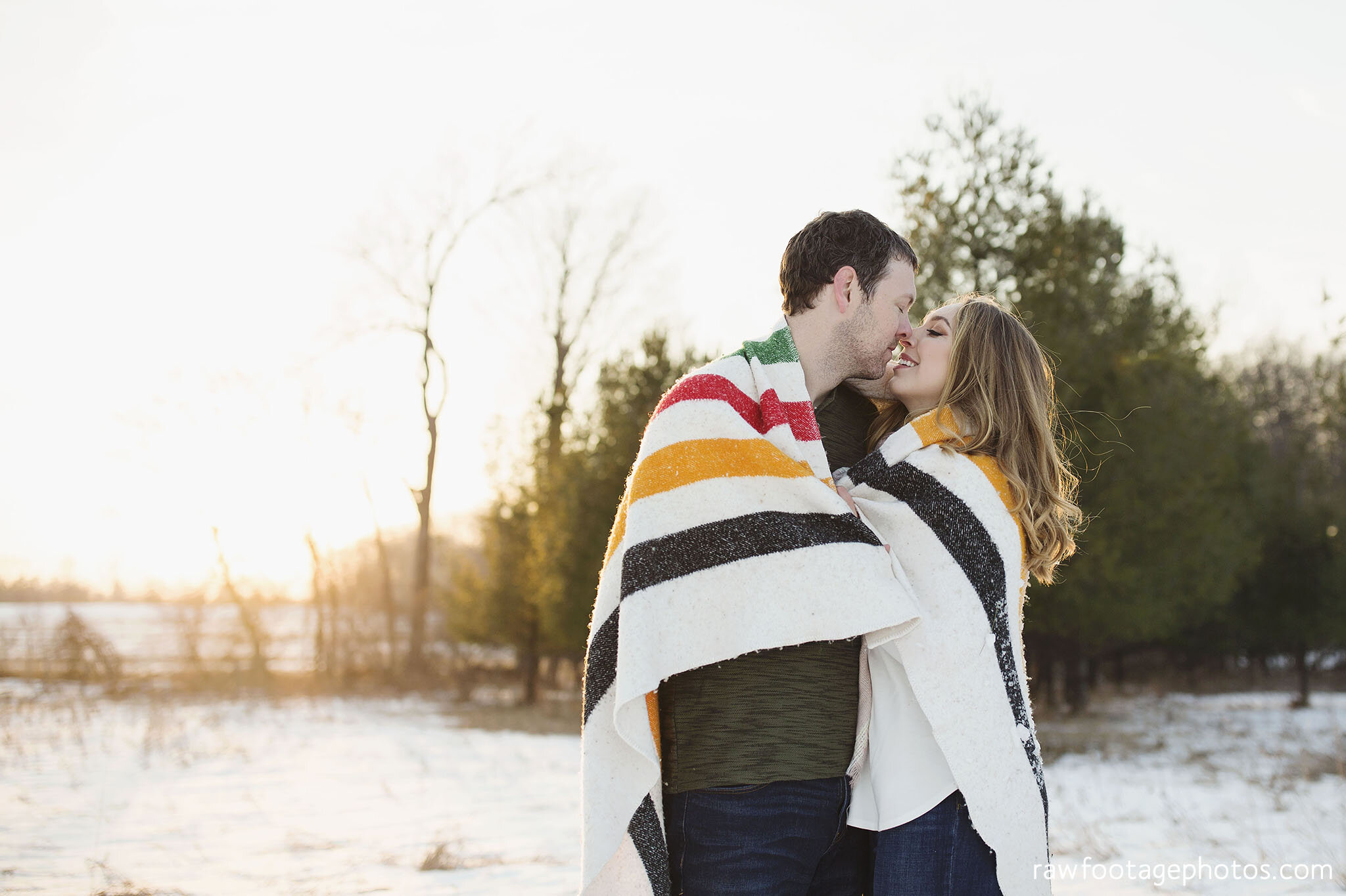 london_ontario_wedding_photographer-engagement_session-winter_e_session-snowy_couple_session-golden_hour_photos-cozy_winter_session-raw_footage_photography-dog024.jpg