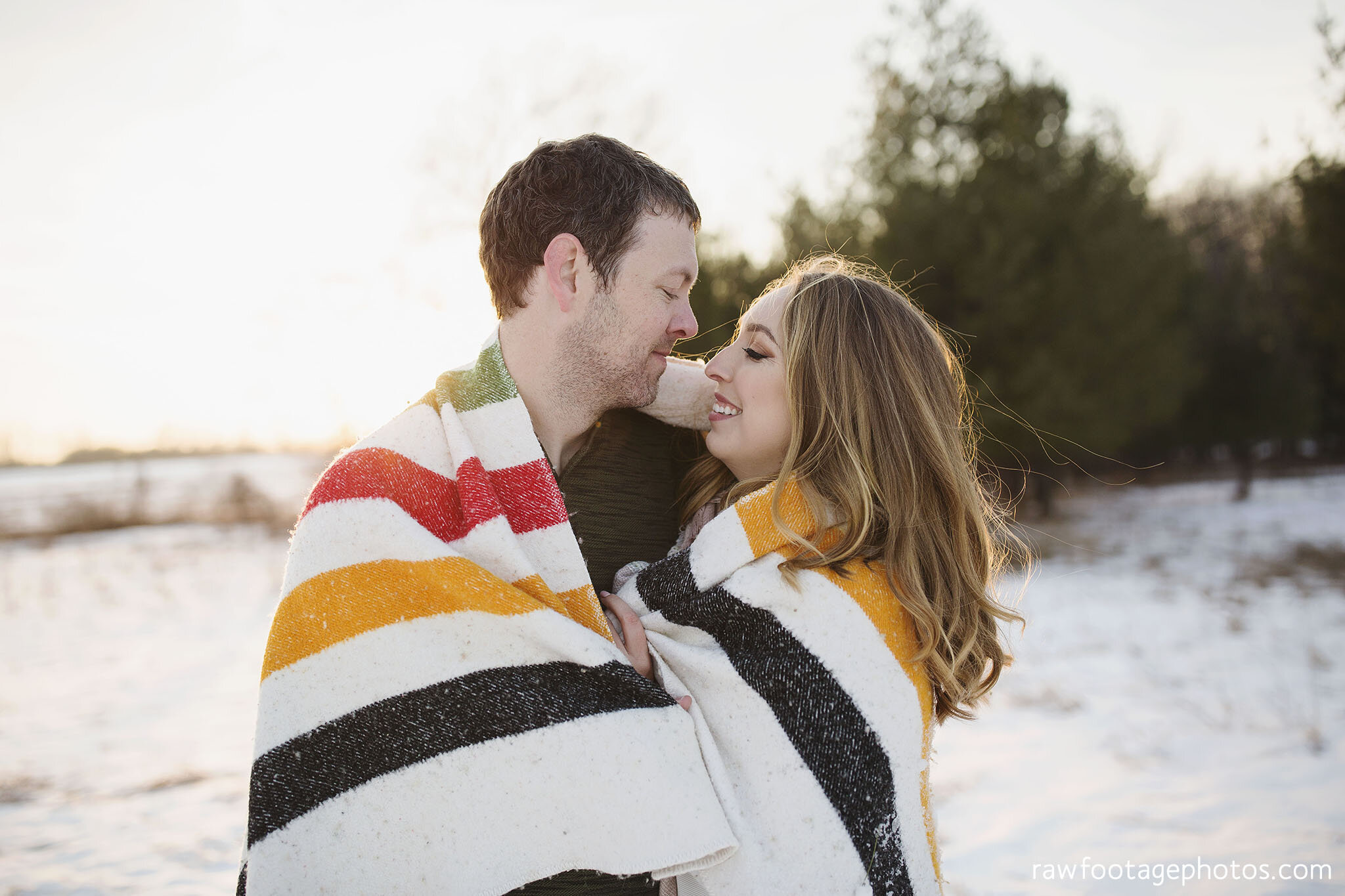 london_ontario_wedding_photographer-engagement_session-winter_e_session-snowy_couple_session-golden_hour_photos-cozy_winter_session-raw_footage_photography-dog025.jpg