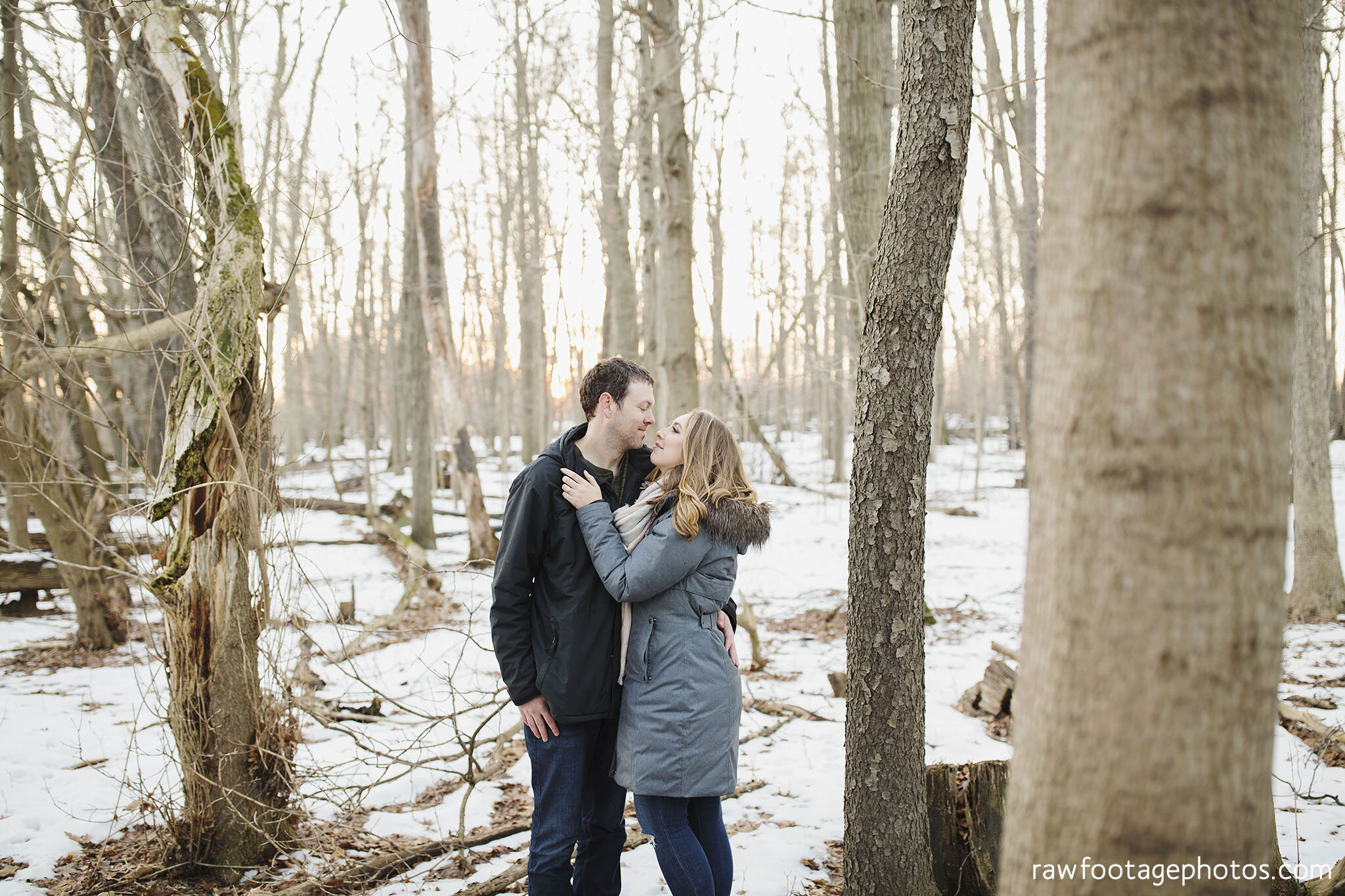 london_ontario_wedding_photographer-engagement_session-winter_e_session-snowy_couple_session-golden_hour_photos-cozy_winter_session-raw_footage_photography-dog030.jpg