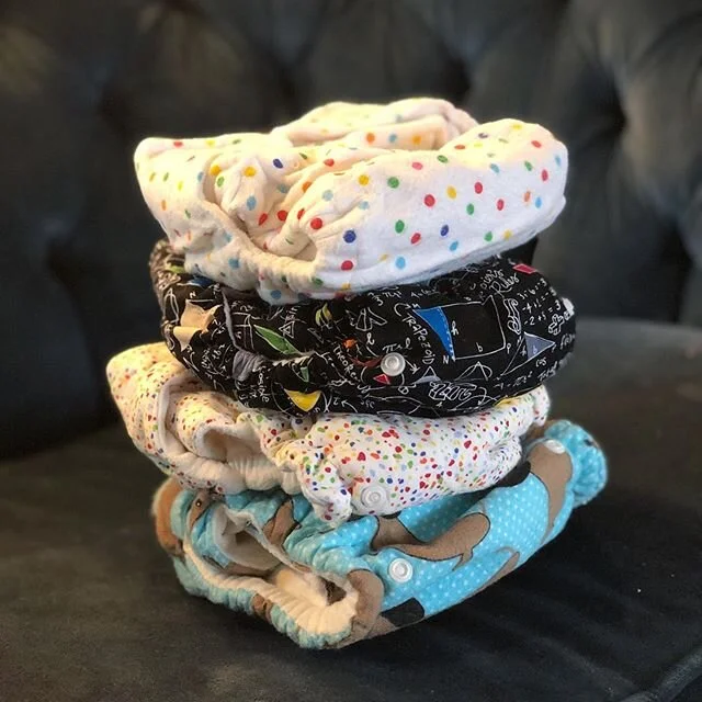 Once upon a time I was about to be a mom. I had what many to-be moms have: time, good intentions, and completely unrealistic expectations. It was a great, albeit short-lived, phase in life. I was such a good mom before I had kids.
.
So I convinced myself that we needed to save money by using cloth diapers (we didn&rsquo;t). But because cloth diapers are expensive, I obviously needed to sew them (I didn&rsquo;t).
.
I researched. I got patterns. I learned how to install snaps. I made them expandable to grow with my baby. I thought the white waterproof fabric wasn&rsquo;t cute enough so I layered cute fabric over the waterproof fabric.
.
Were they cute? Yes. Environmentally conscientious? Yep. Economically beneficial? You bet. Waterproof? Not at all.
.
Apparently when you put non-waterproof fabric over waterproof fabric, them item is - wait for it - no longer waterproof! After spending something like 50 hours sewing 22 (TWENTY TWO) cloth diapers, I tried to troubleshoot the leakage for approximately 12 minutes before making the executive decision that - low and behold - we are not cloth diaper people, after all! This was just the first of many hard-knock life lessons parenthood has offered me.
.
So here we are. My child is now almost 6 and, not to brag, but he&rsquo;s 99% potty trained. I have moved a giant sack of unused cloth diapers cross-country TWICE because I cannot bring myself to throw away what took me so much time to make. The end.
.
So now that I&rsquo;ve talked them up, hows about a giveaway? 🌈🙃 In all seriousness, these would probably work just fine with a waterproof cover and a parent with a higher combination of patience &amp; brain cells than I apparently possess. If you want them, or know someone who does, holler at me and they&rsquo;re yours (porch pickup). I even have one brand new Bum Genius diaper that I bought as inspiration at some point, so 1/22 are guaranteed to meet your diapering needs.
.
#diy #diyfail #clothdiapers #clothdiapering #giveaway #free #momlife #momsofinstagram #sewing #mamatried