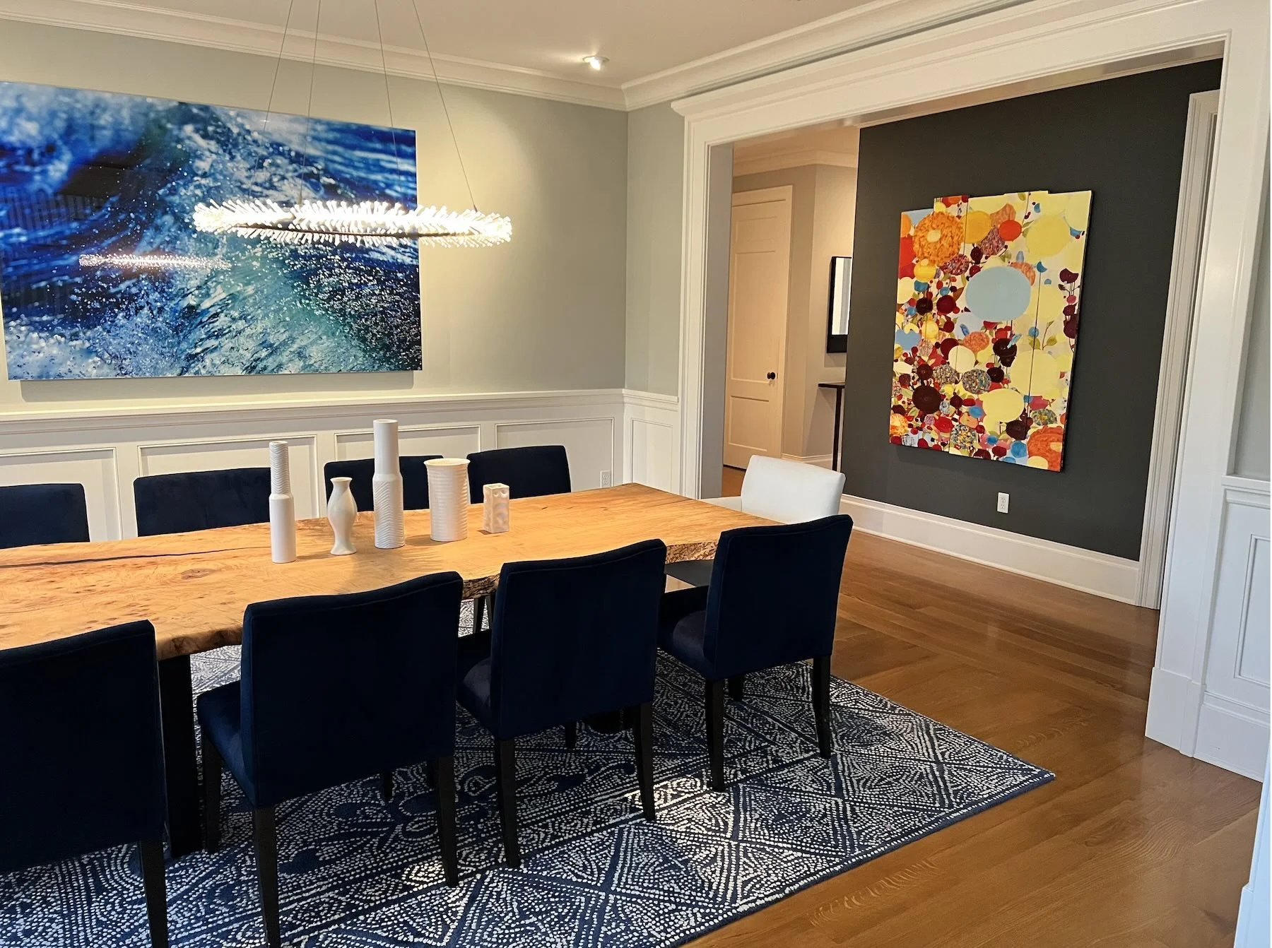 Custom figured maple live edge dining table in a contemporary dining room