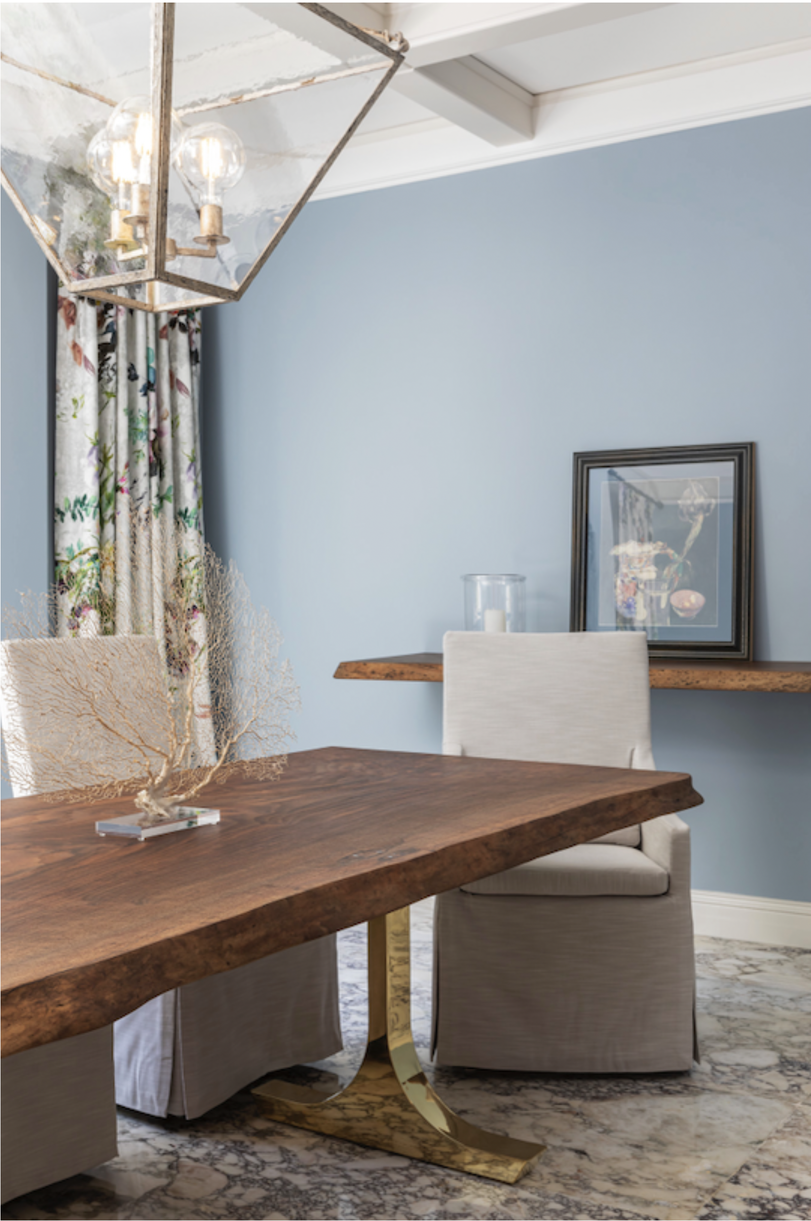 Finished custom walnut live edge dining table in a luxury residential dining room