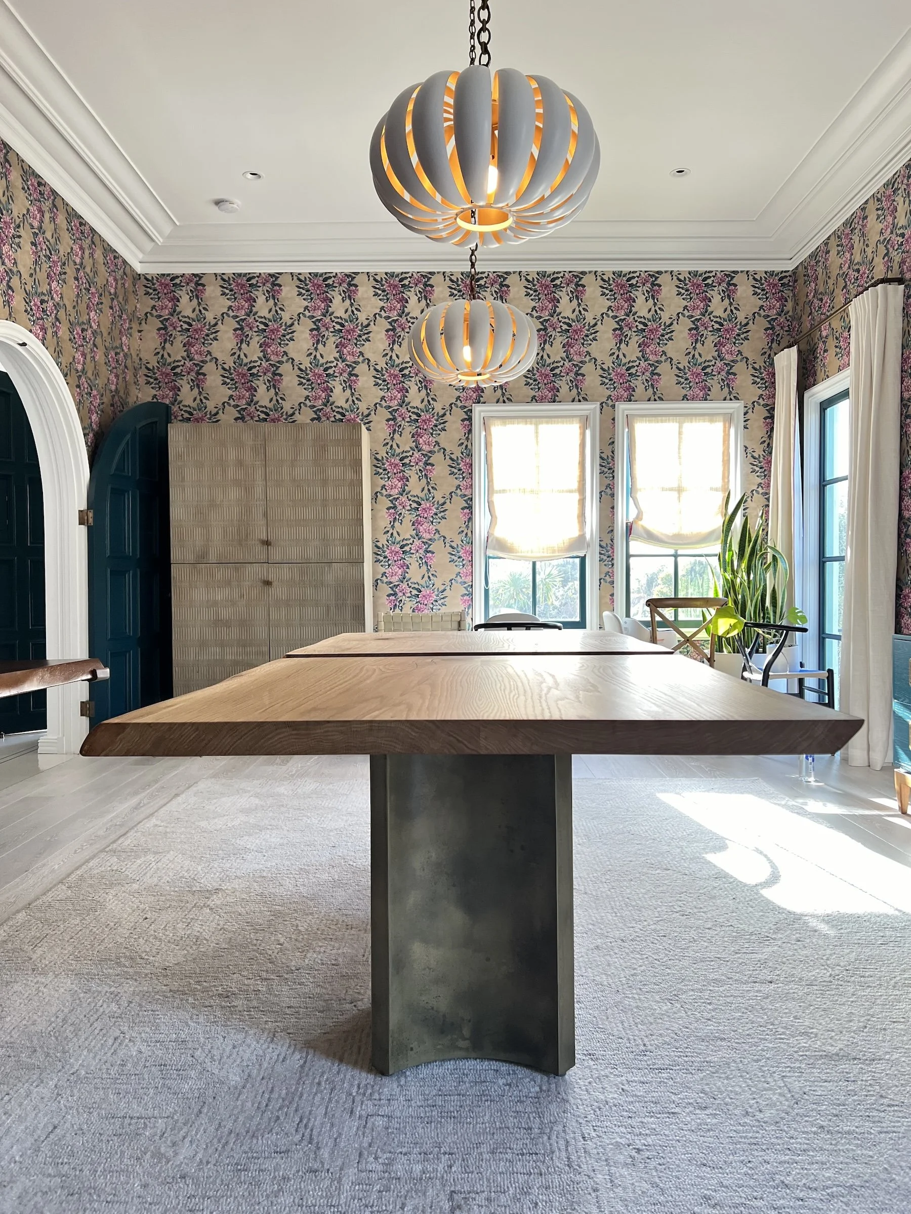 Modern white oak live edge dining table in a bright contemporary home