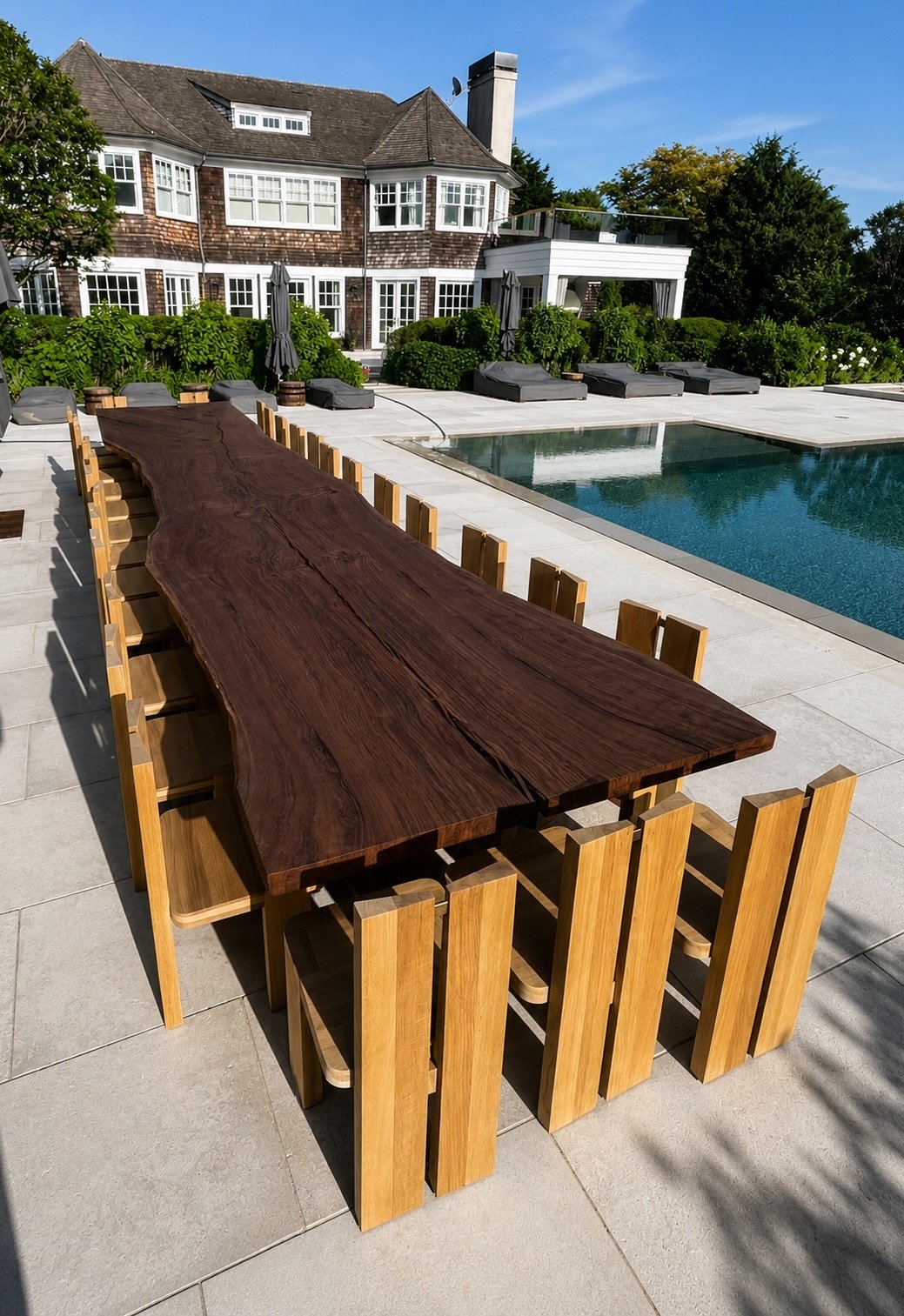 25-foot custom Claro walnut live edge dining table at a Hamptons residence