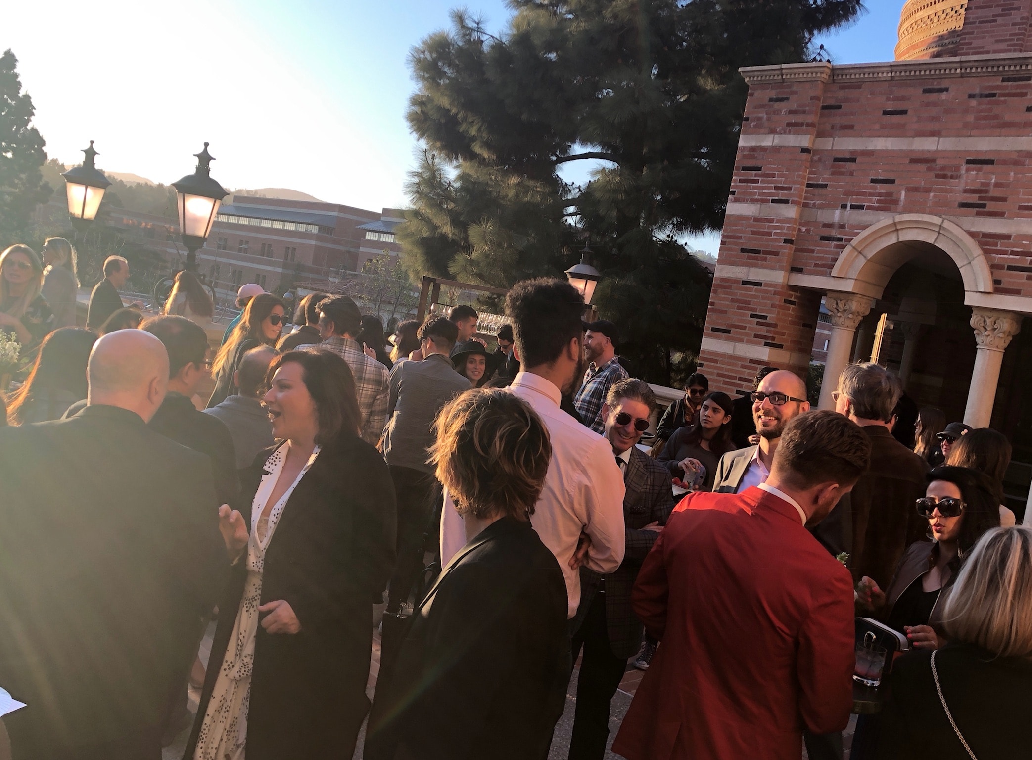 Guests mingling on the terrace of Royce Hall