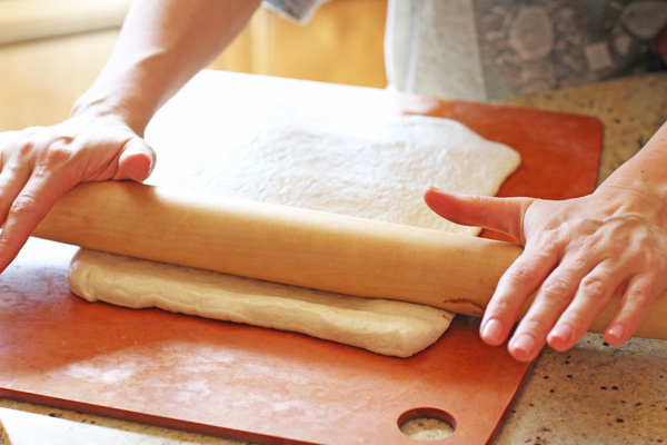 Using a rolling pin gently roll out your dough so it's a little thinner.