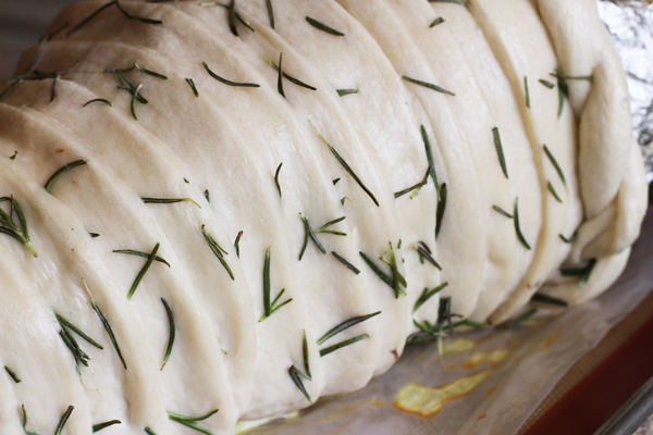 Here is the herb version with the flat pieces and the braided top. Ok this is ready to go. Preheat your oven to 350 degrees and while it's heating beat one egg with 1 tsp of water in a small bowl. Brush your dough with the egg wash so it gets a shiny golden color when it bakes. Now this has to go into the oven at 350 degrees for 20-35 minutes. Put all your racks down to the bottom so the cornucopia has plenty of room to cook. I know this is a big time frame but it depends on how large you made your cornucopia. The bread should be golden brown when you take it out of the oven. TIP: If the highest part of your cornucopia starts getting too brown just place a thin piece of foil over only that section.