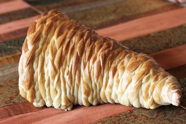 This is the braided version. Each strip was braided and then wrapped. There were no flat pieces.