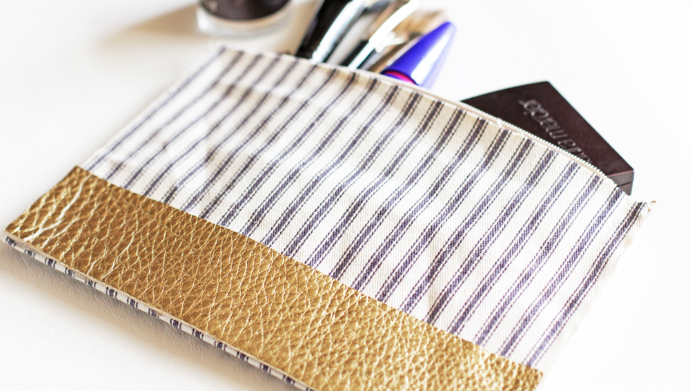 On this bag I used canvas in the same way I did the leather version and then took a strip of gold leather and just applied it to the front of the pouch.